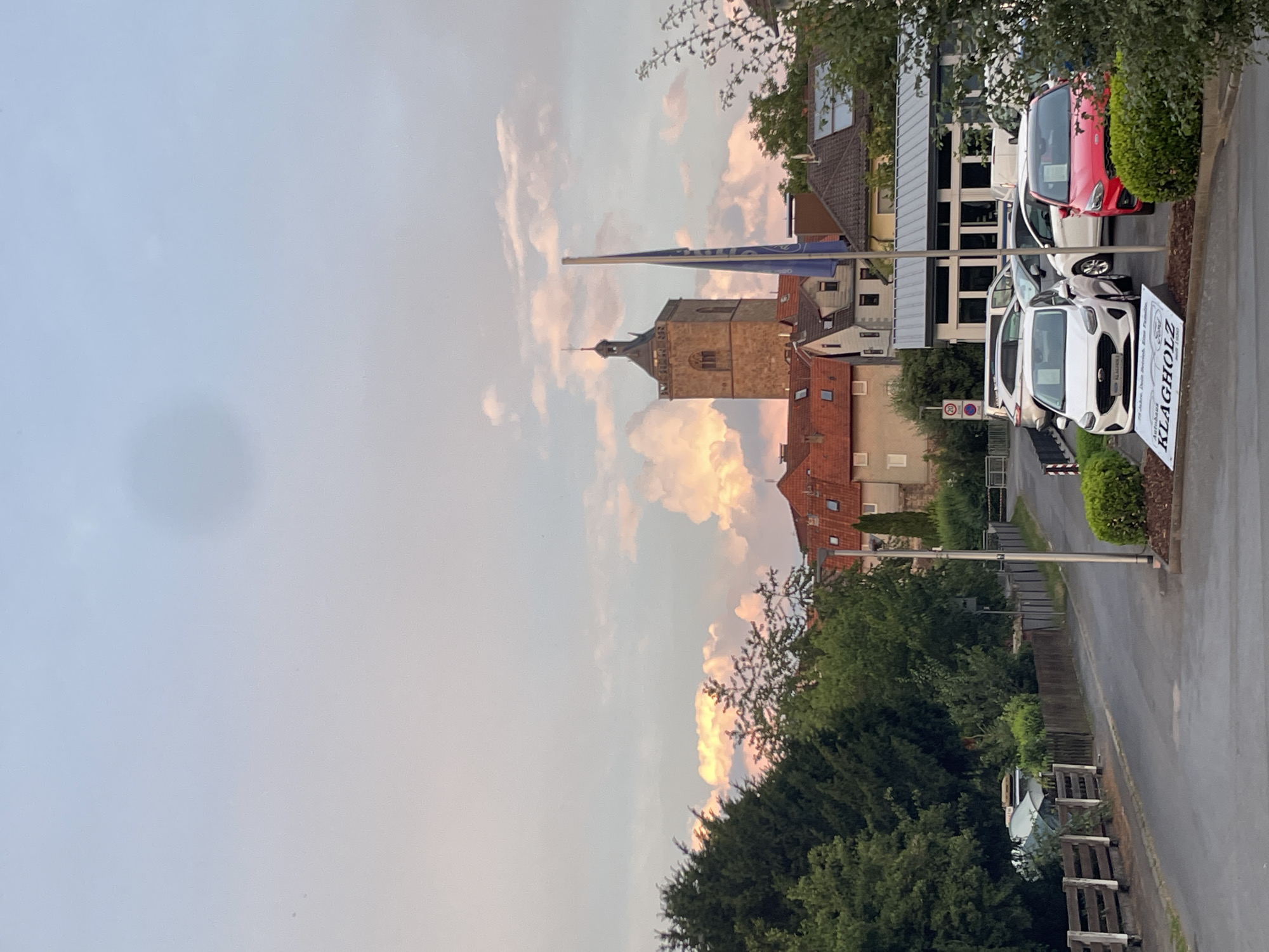 Evening stroll through Neukirchen's historic town center at sunset