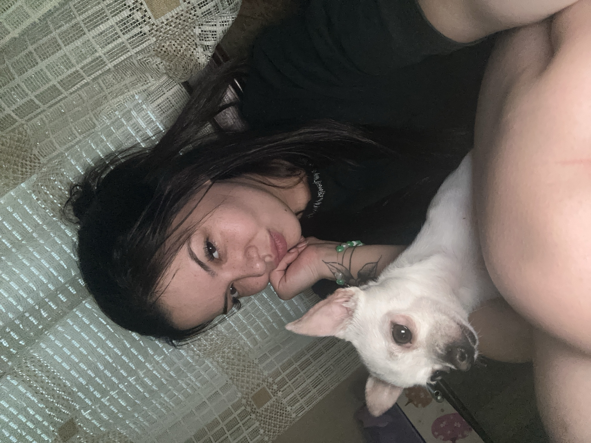 Woman and small white dog share quiet moments indoors