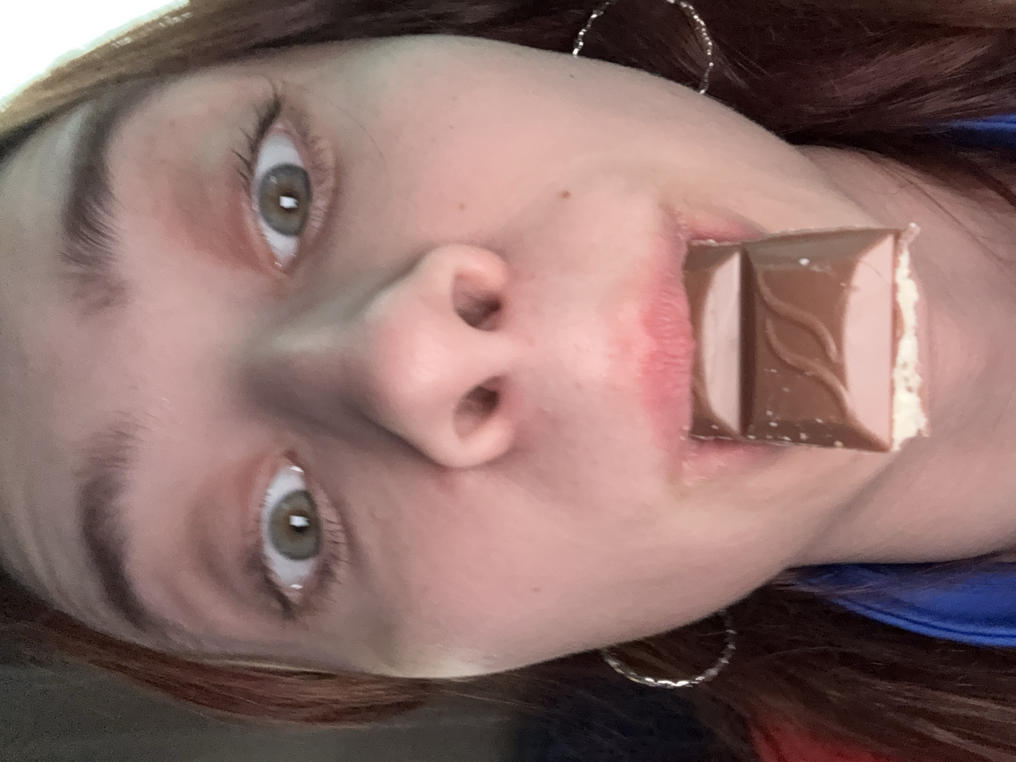Person photographed eating chocolate bar in Zvyozdny, Russia