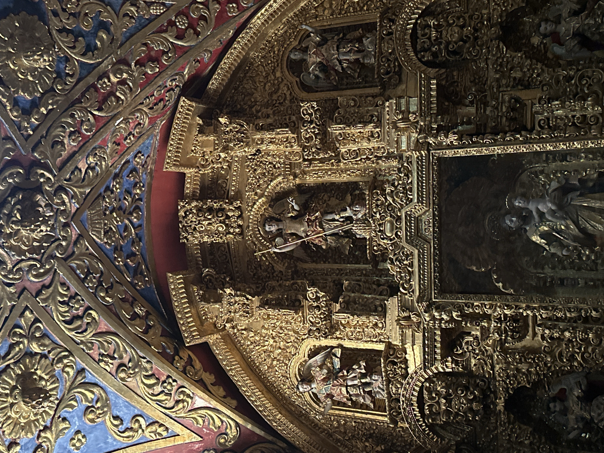 Visitor documents baroque church architecture in Tepotzotlán, Mexico