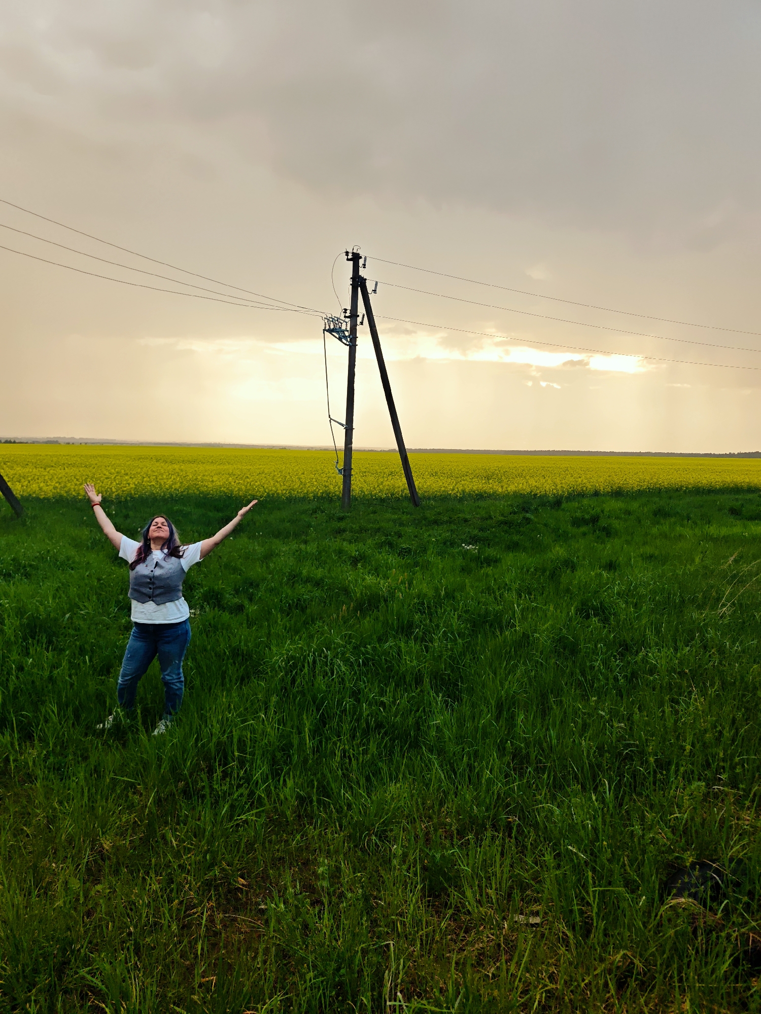 Woman photographed in Russian countryside near utility infrastructure