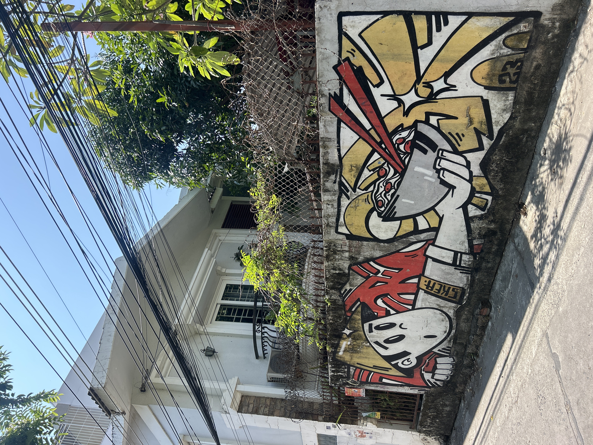 Early morning documentation captures street art and urban life in Bắc Nha Trang