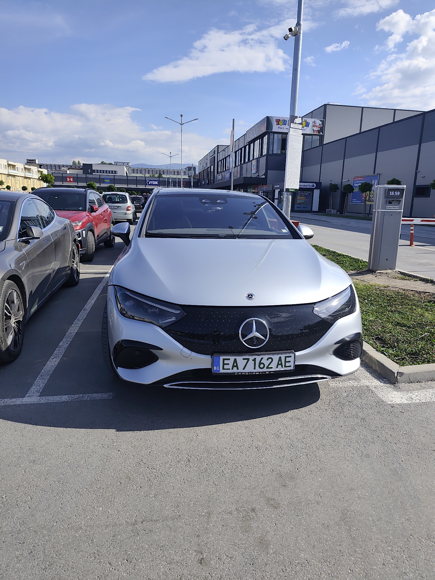 Everyday parking lot scene documented at Plovdiv shopping complex