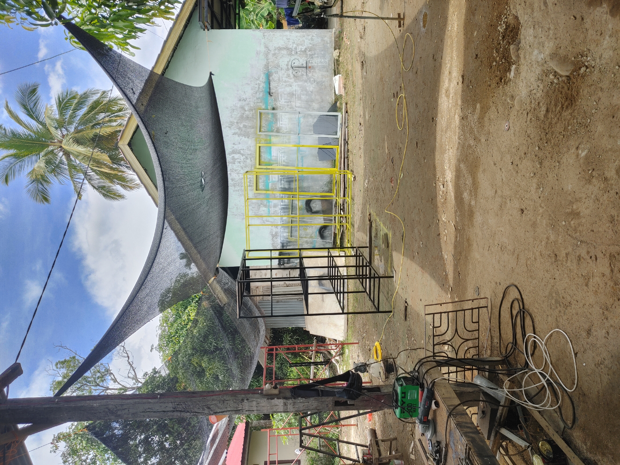 Metalwork and gate fabrication at a rural workshop in Mee, Indonesia