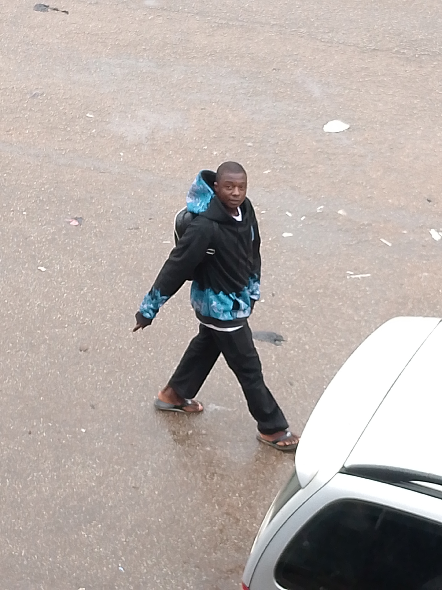Everyday street life continues after rainfall in Bukuru, Nigeria
