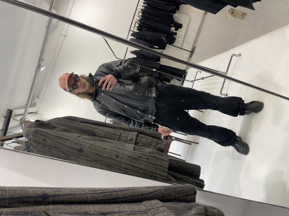 Shopper browses Paris fashion boutique, takes mirror selfie