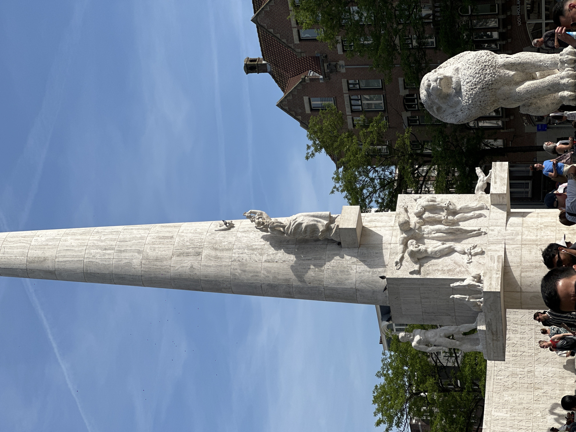 Tourist documents afternoon walk through Amsterdam's Dam Square area