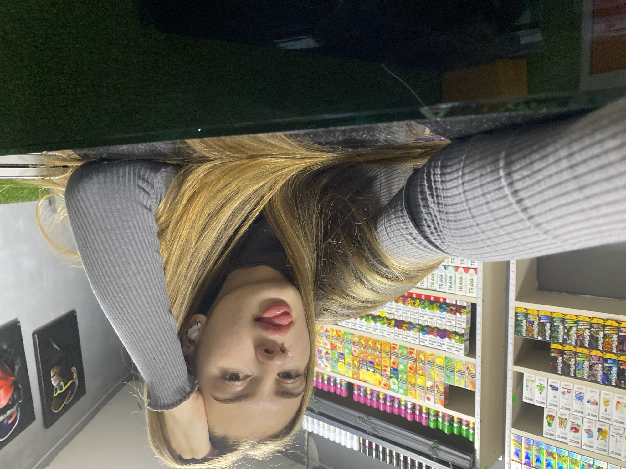 Woman poses for photos inside Russian vape shop