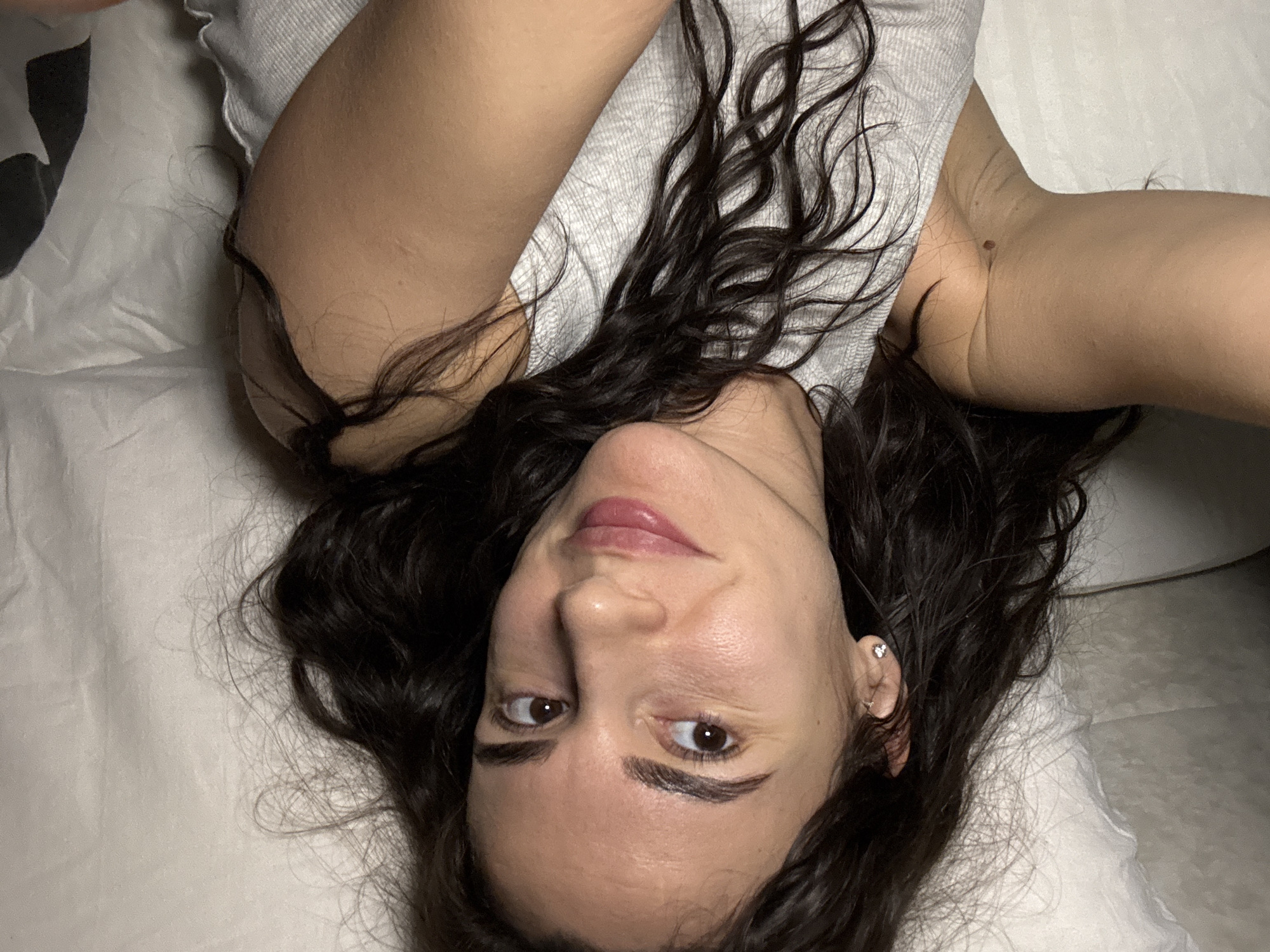 Woman observed resting on white surface in Chaikovsky