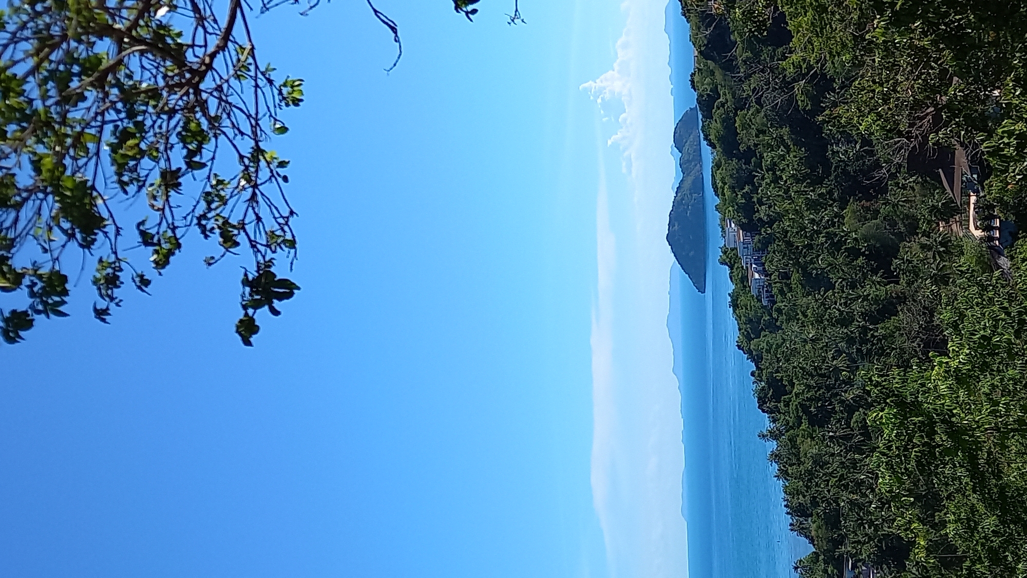 Hillside views of Koh Phangan's coastline on a clear morning