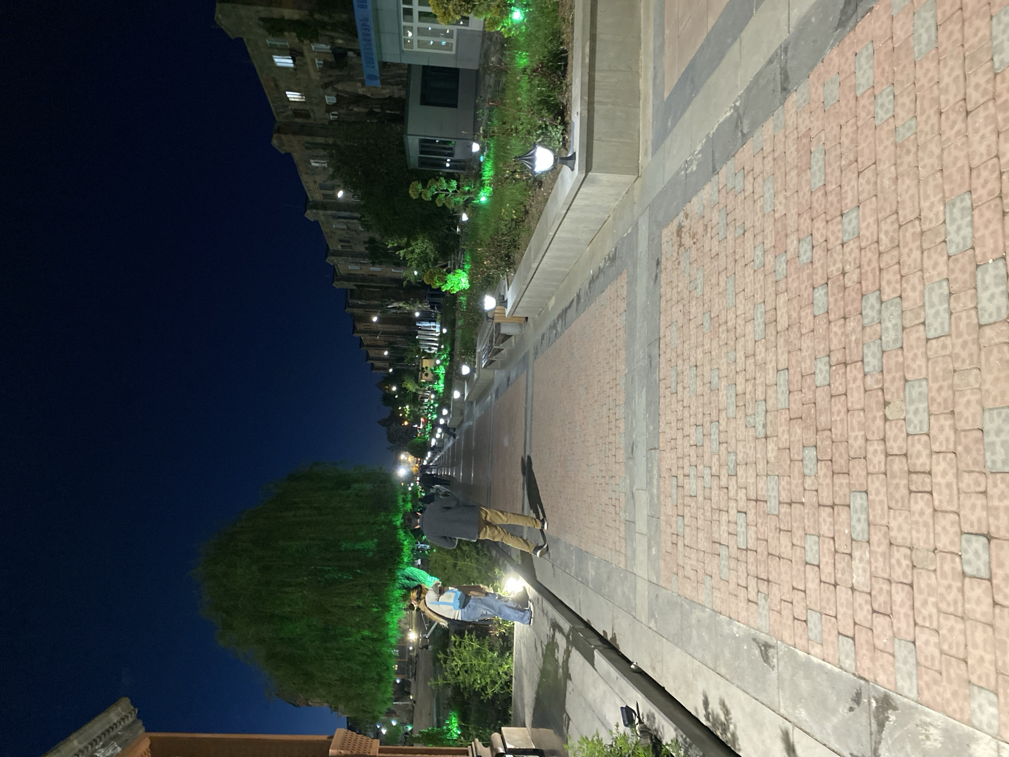 Night view of a lit pedestrian walkway in Gyumri, Armenia