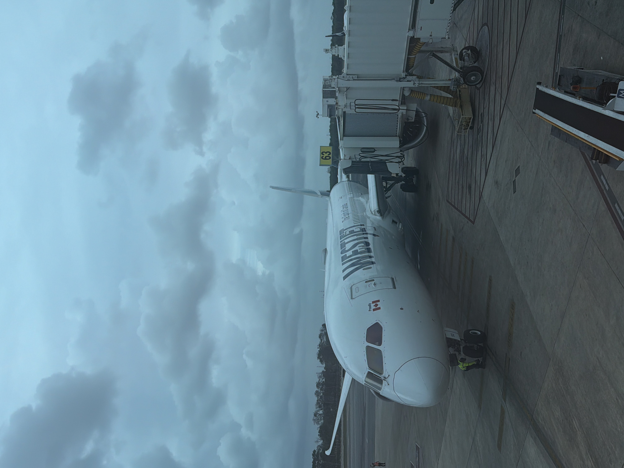 WestJet Boeing 787 parked at Cancún Airport gate