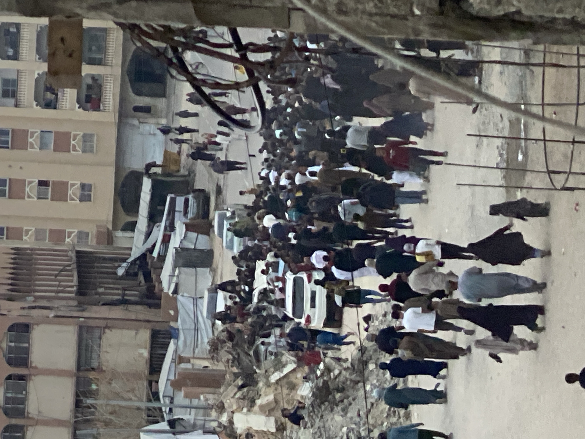 Crowds gather amid debris in Khan Yunis streets