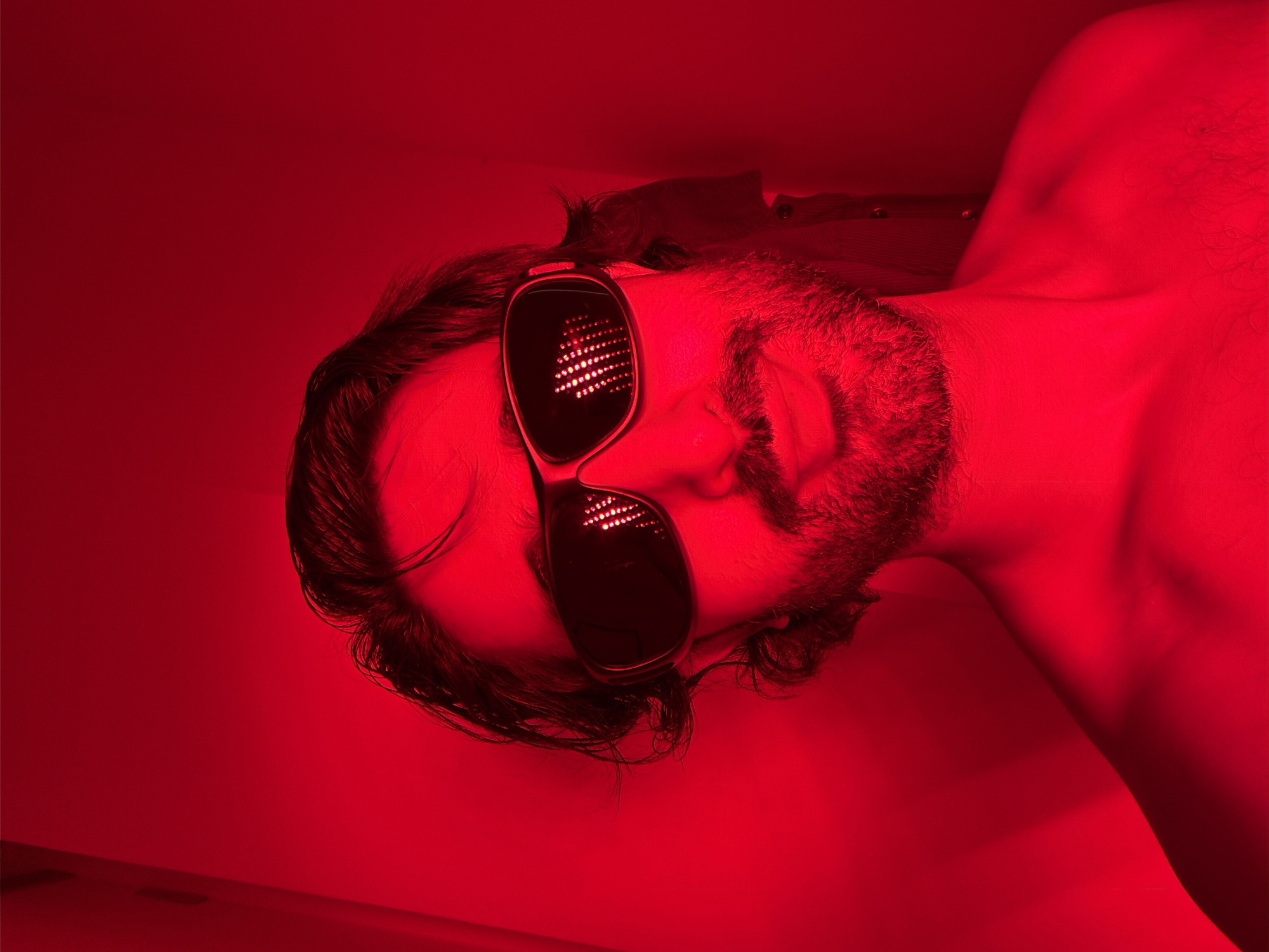 Man photographed with red LED light panel in London