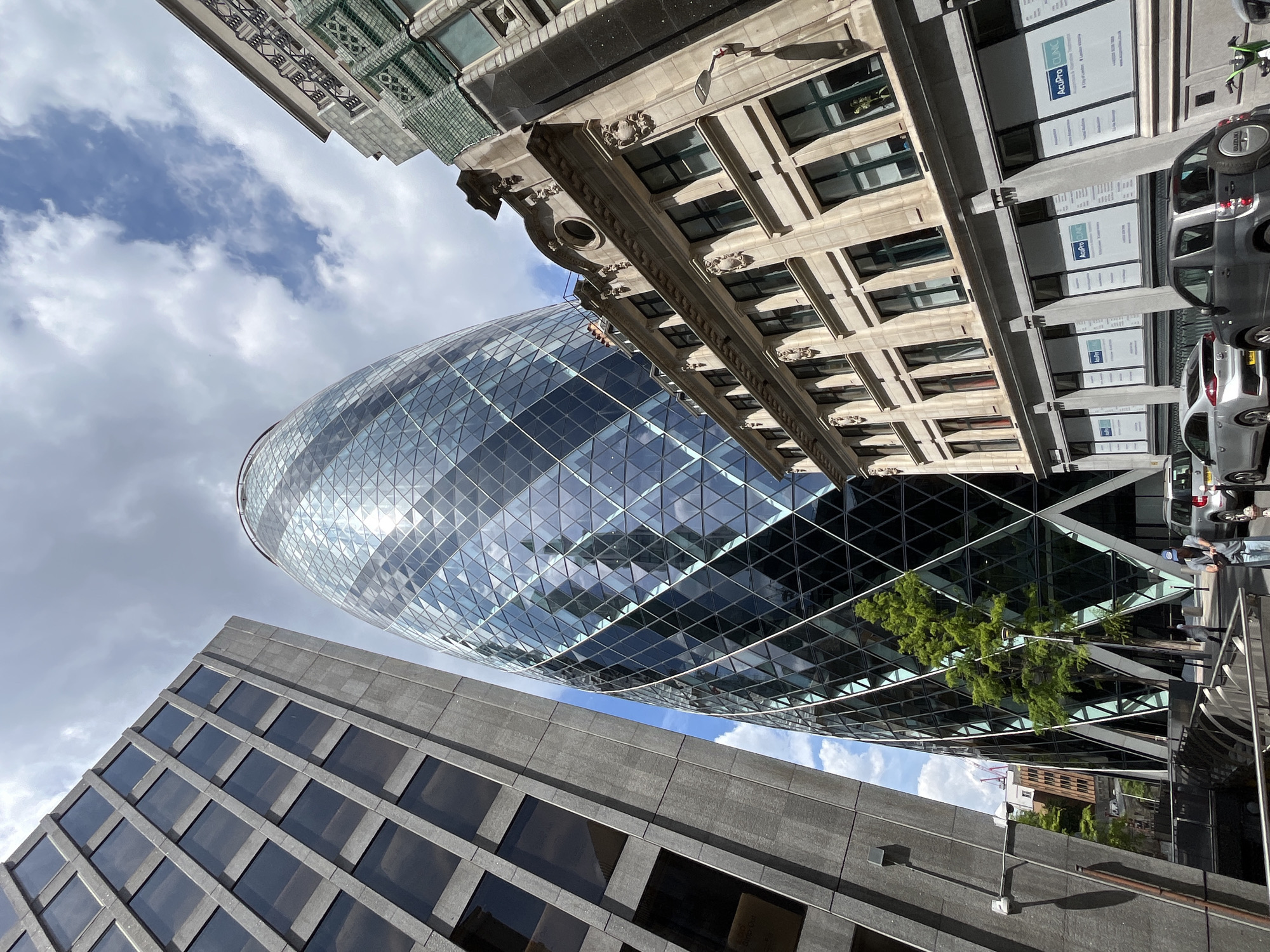 Street-level views of the Gherkin and City of London towers
