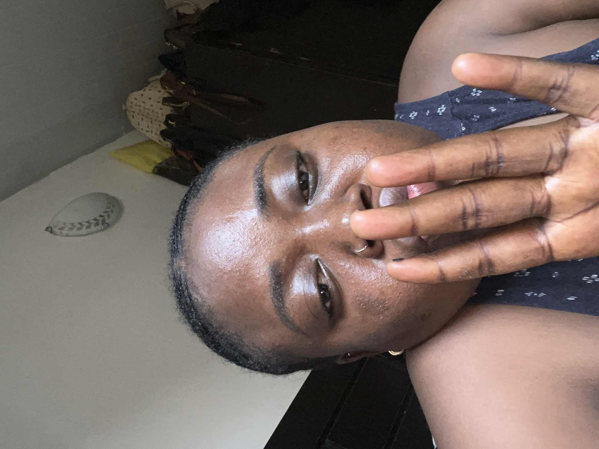 Woman takes selfies in bedroom in Abuja