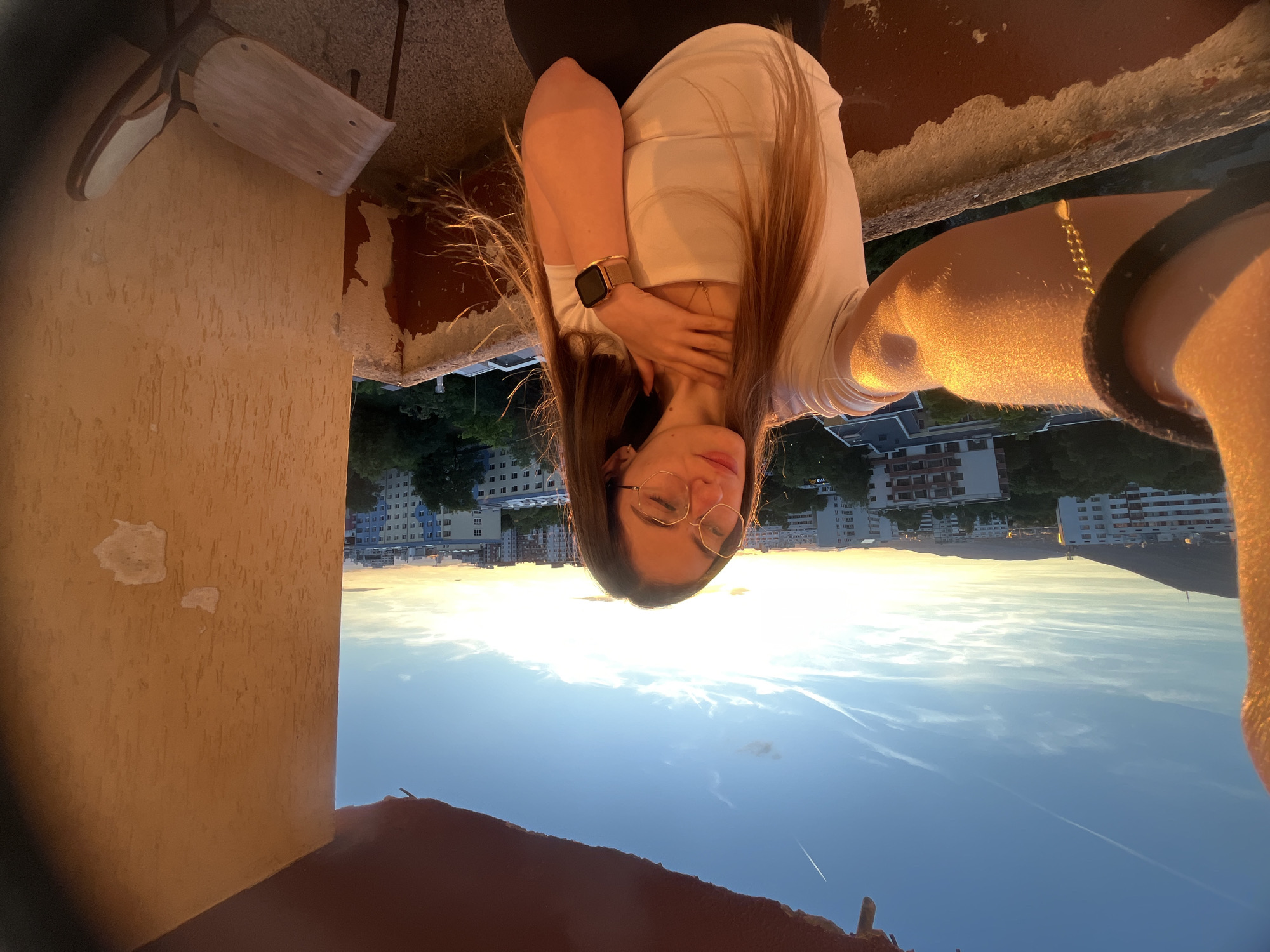 Golden hour photo session on city balcony with multiple angles