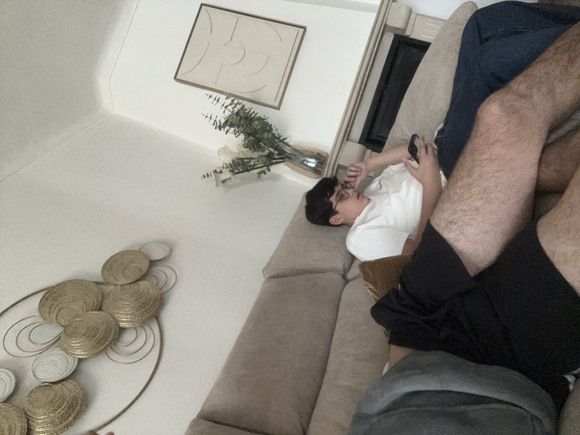 Person using phone on sofa in Vila Real home
