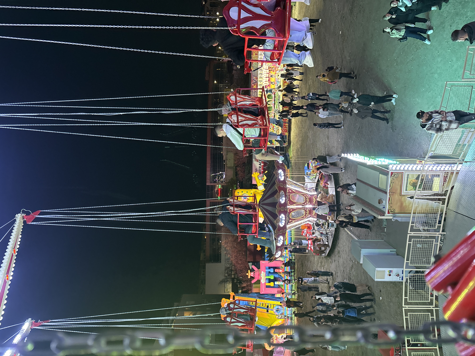Swing carousel operates at Plovdiv amusement park during evening hours