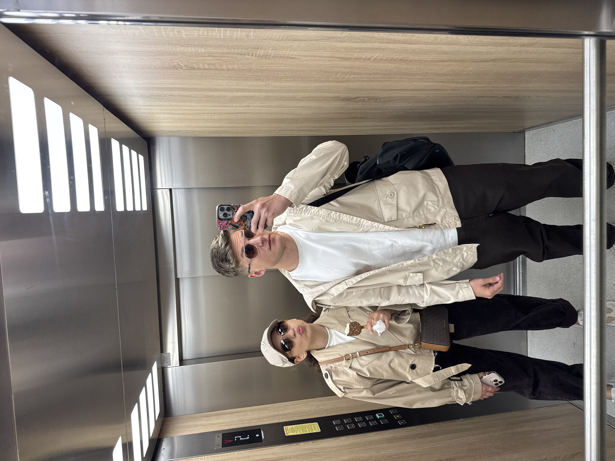 Two people photographed in elevator and outdoors in Plovdiv