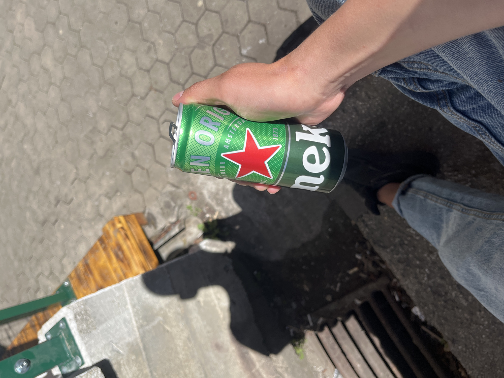 Person enjoys beer outside Sofia food establishment