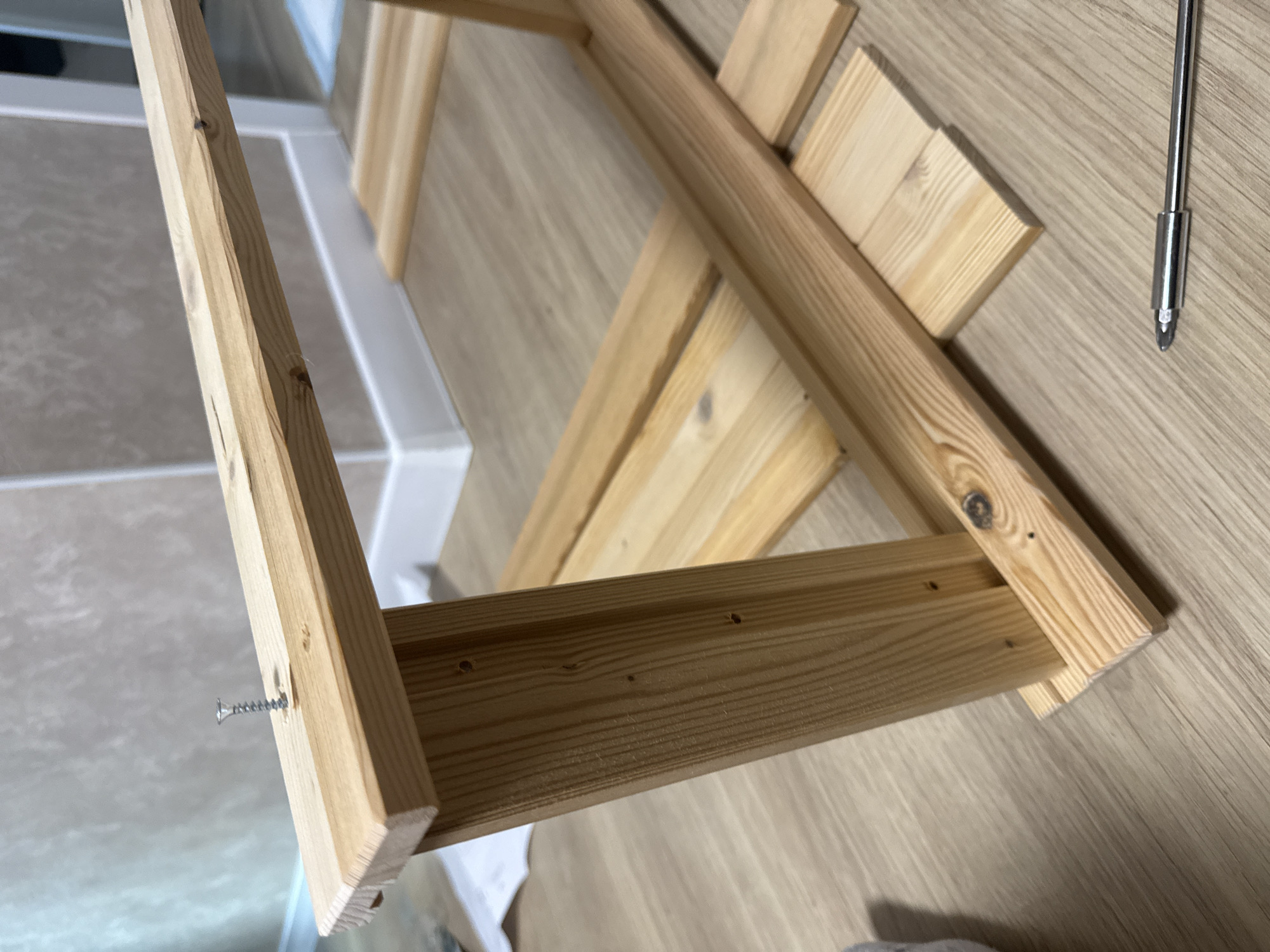Wooden construction project in progress on indoor floor