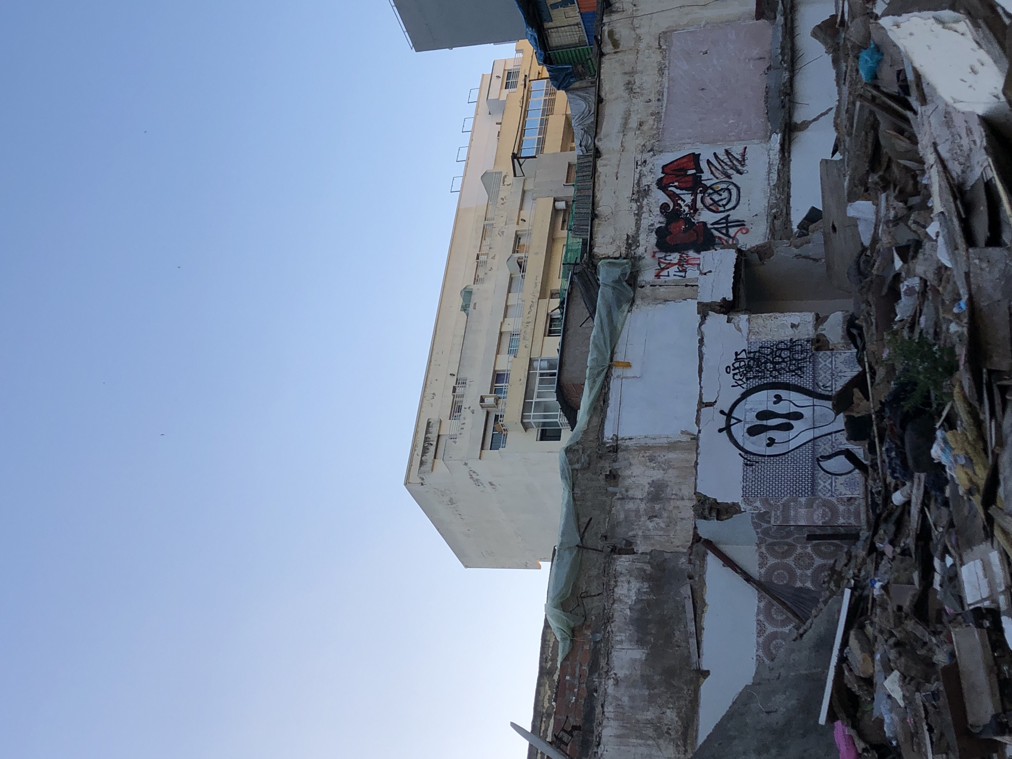 Partially demolished building observed in Casablanca showing graffiti remains