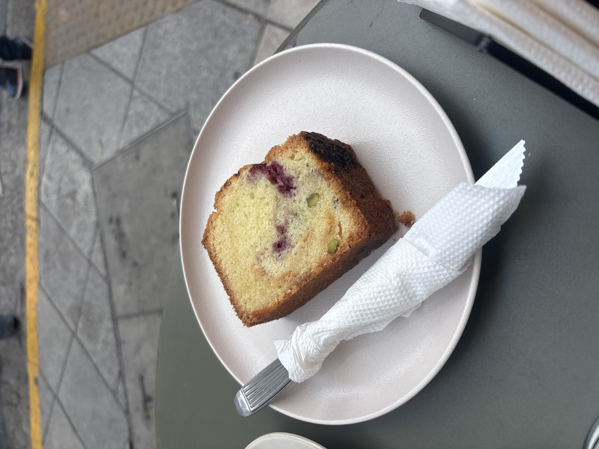 Cafe patron documents dessert and coffee in Buenos Aires