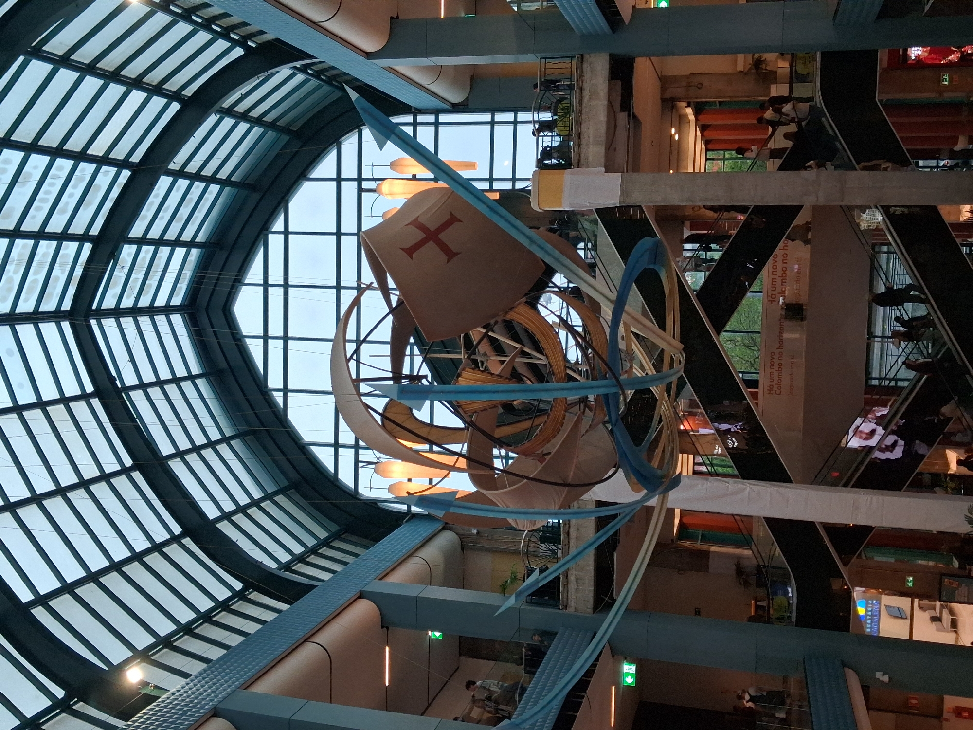 Shoppers observe maritime art installation at Lisbon mall
