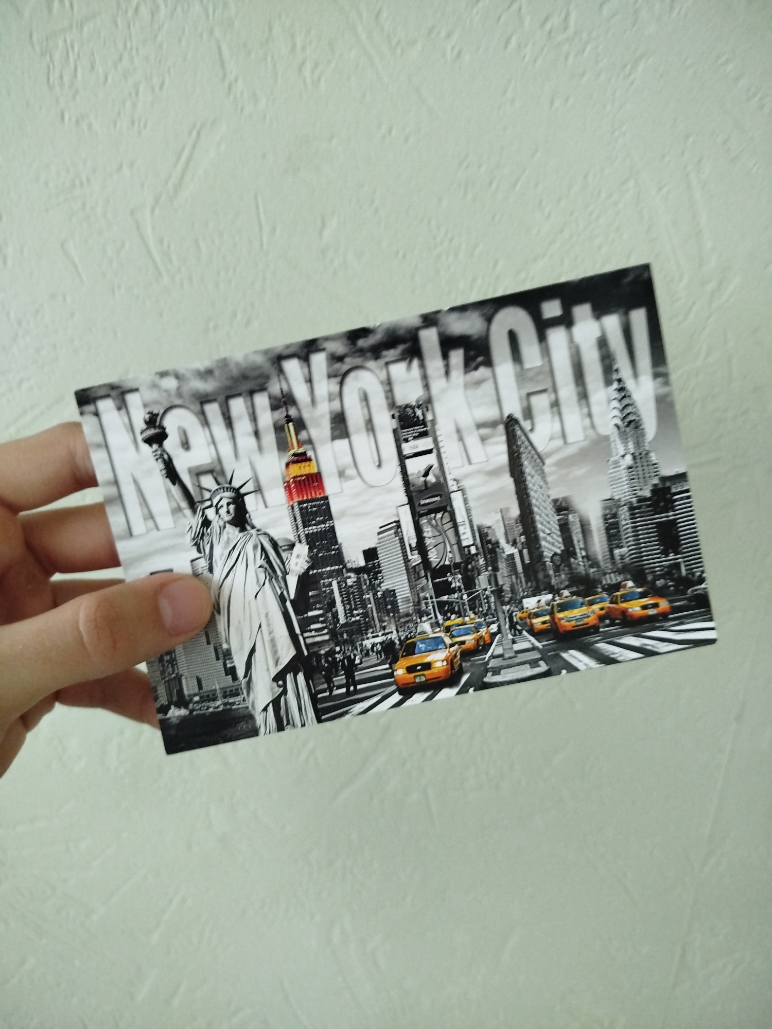 Tourist displays international postcard collection in Varna, Bulgaria