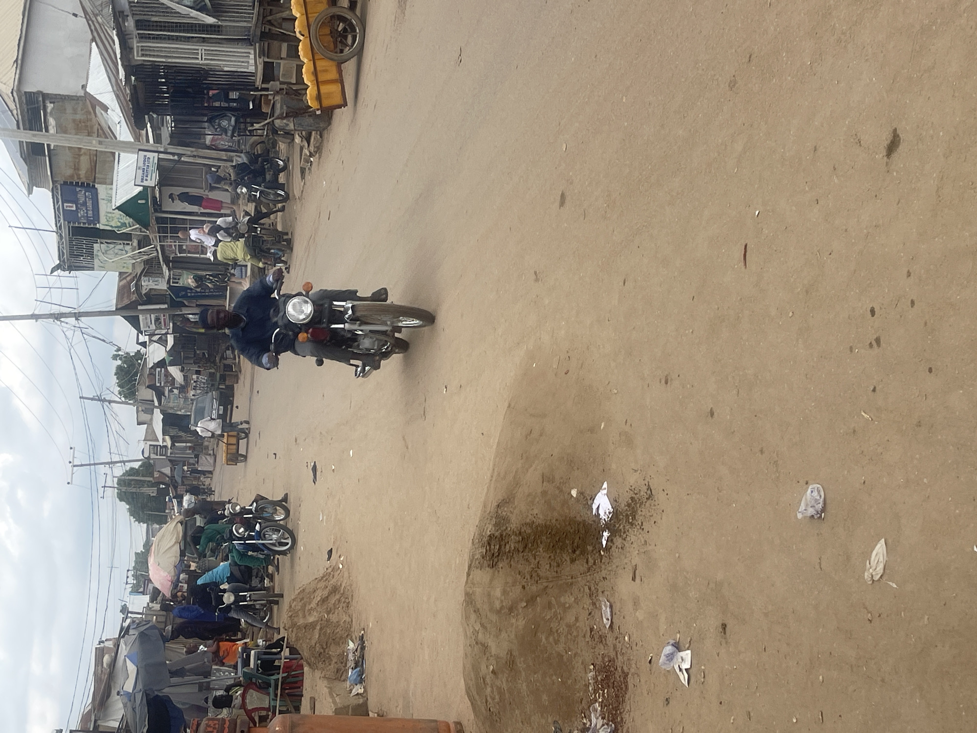 Busy street and shop scenes from an Abuja market area
