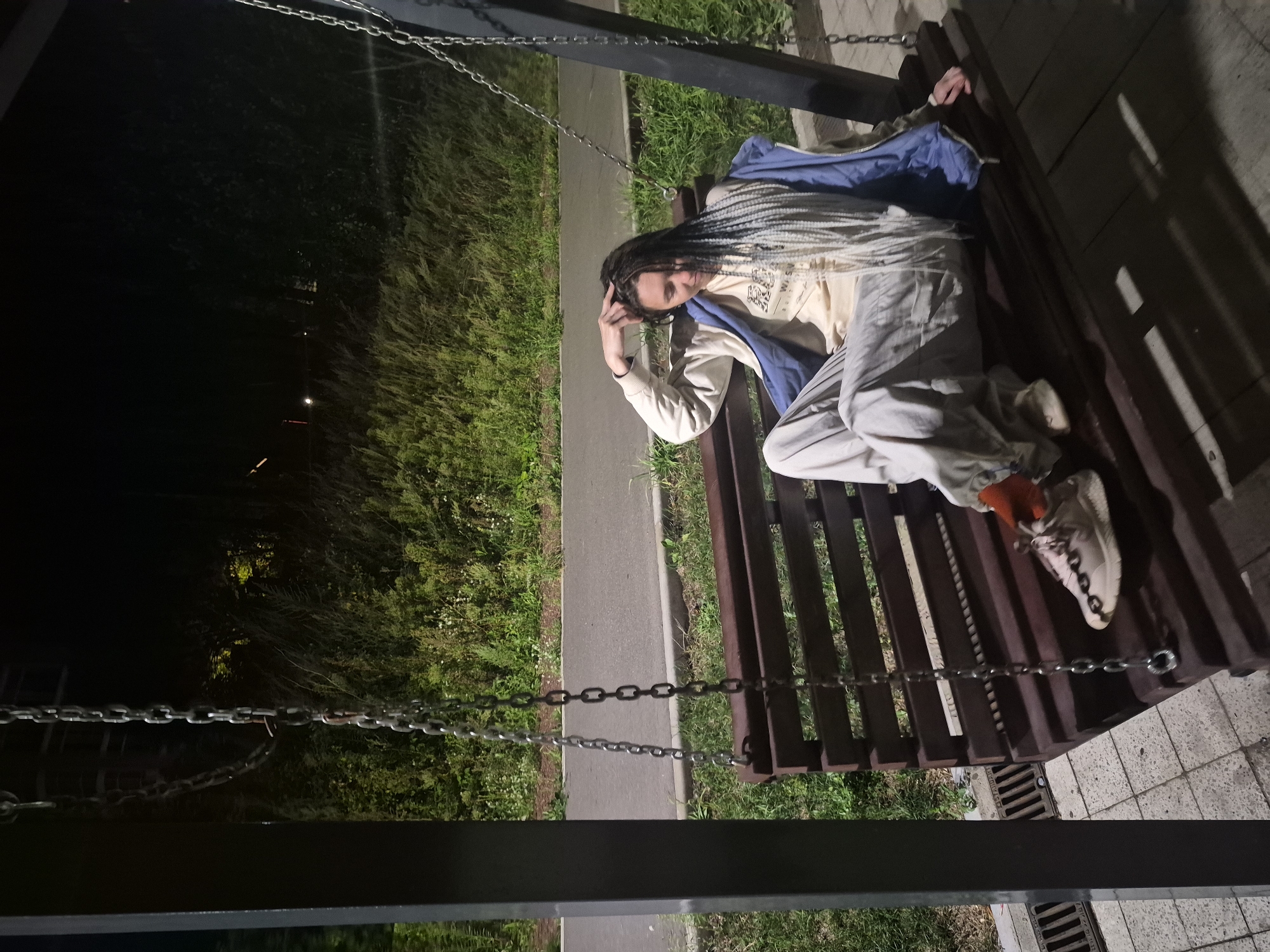 Night out at a Chaikovsky park, swings and waterfront walkway