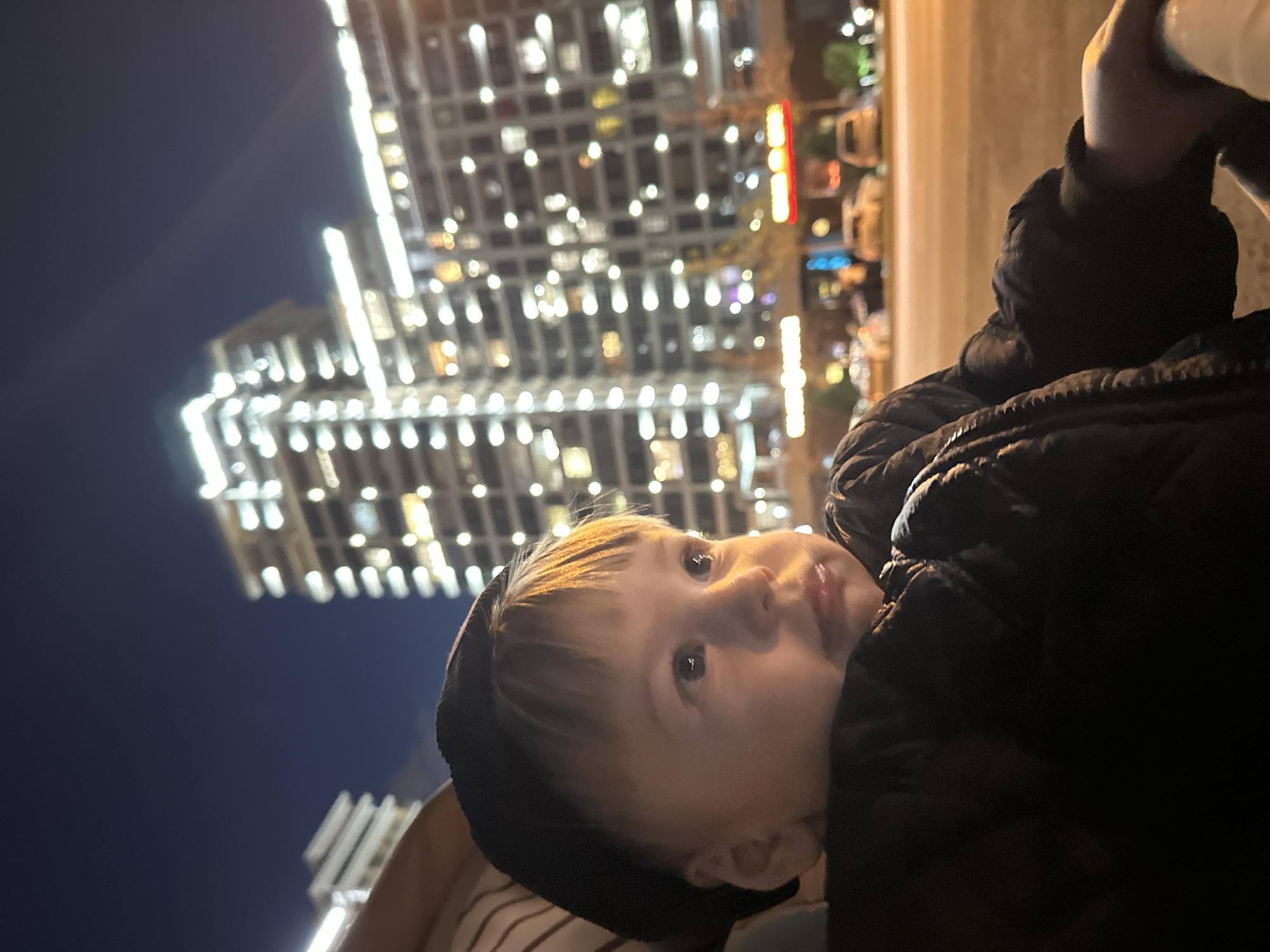 Child in hooded jacket spotted looking upward in Kazan