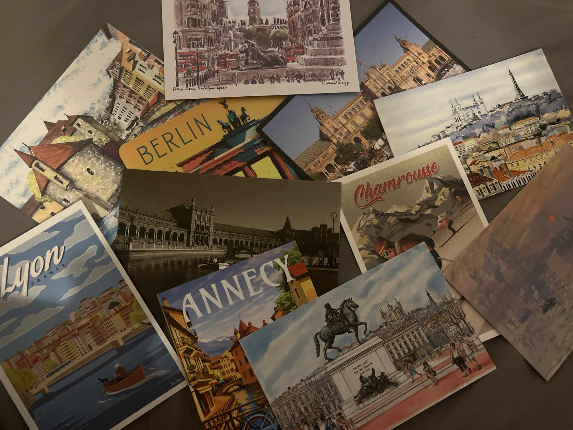 Travel postcard collection documented in Lyon evening session