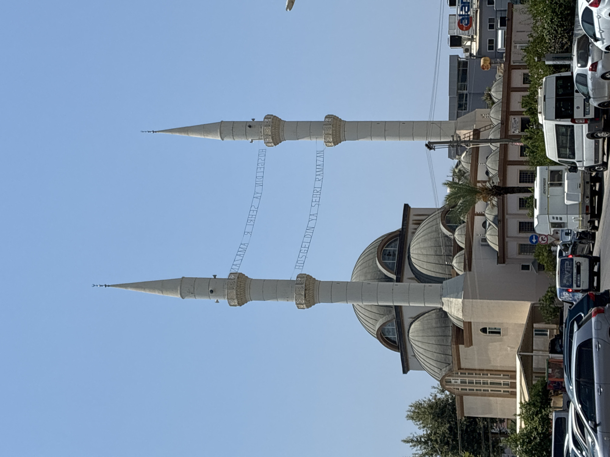 Mosque and colorful apartment buildings in Alanya, Turkey
