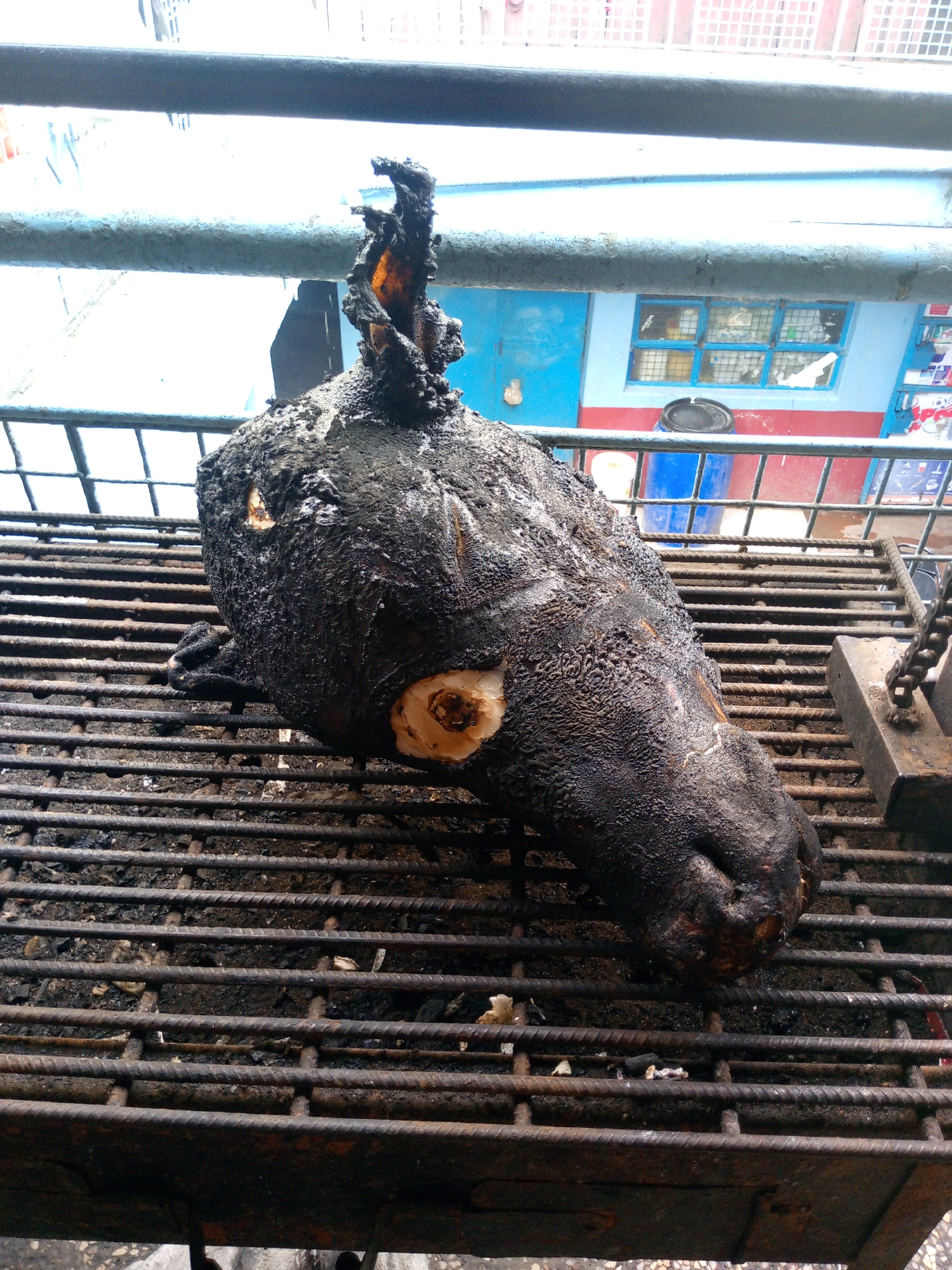 Morning street scenes in Nairobi: food preparation and motorcycle incident