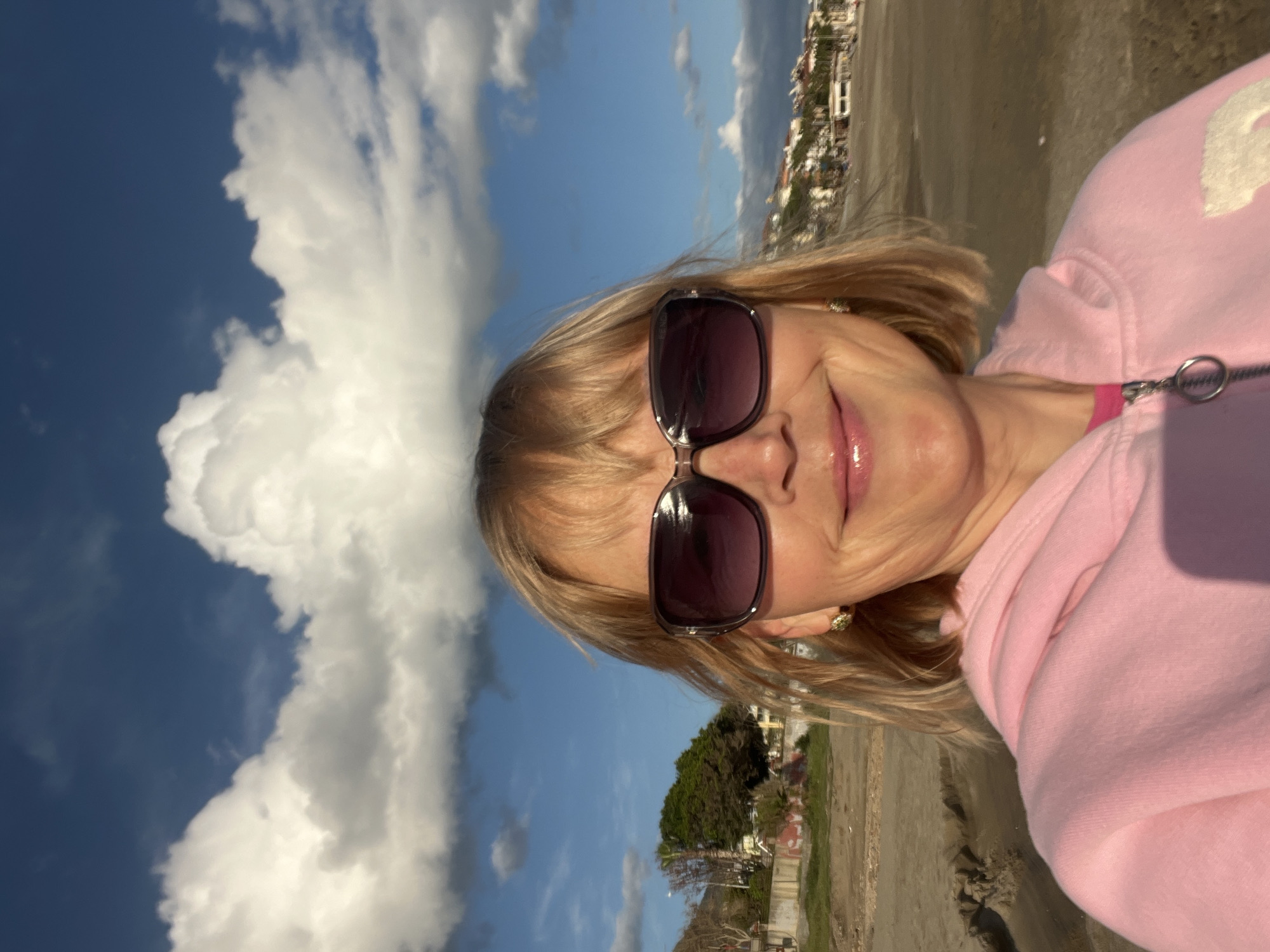 Woman takes beach selfies in Alanya, Turkey