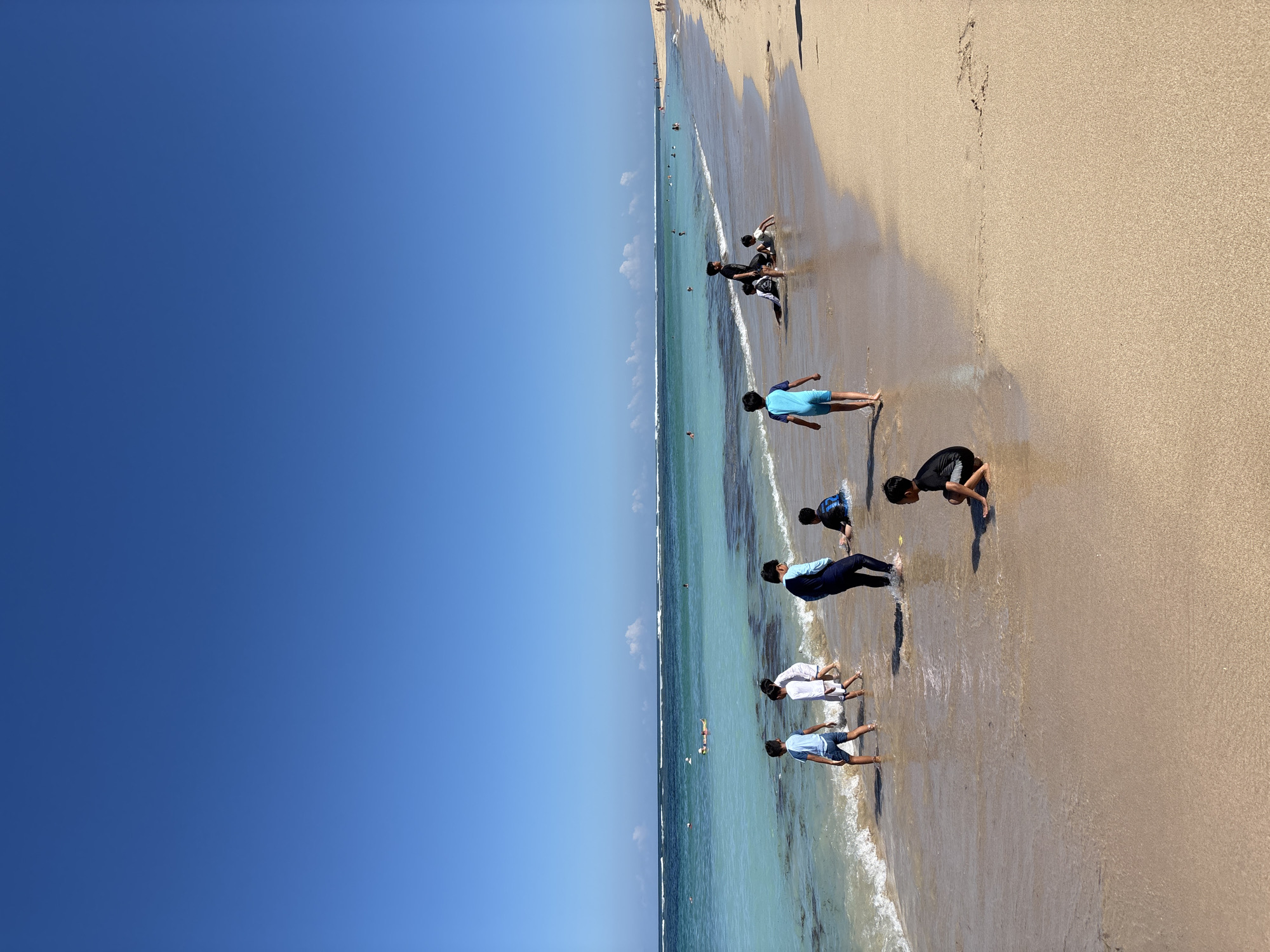 Woman enjoys morning ocean at Nusa Dua beach