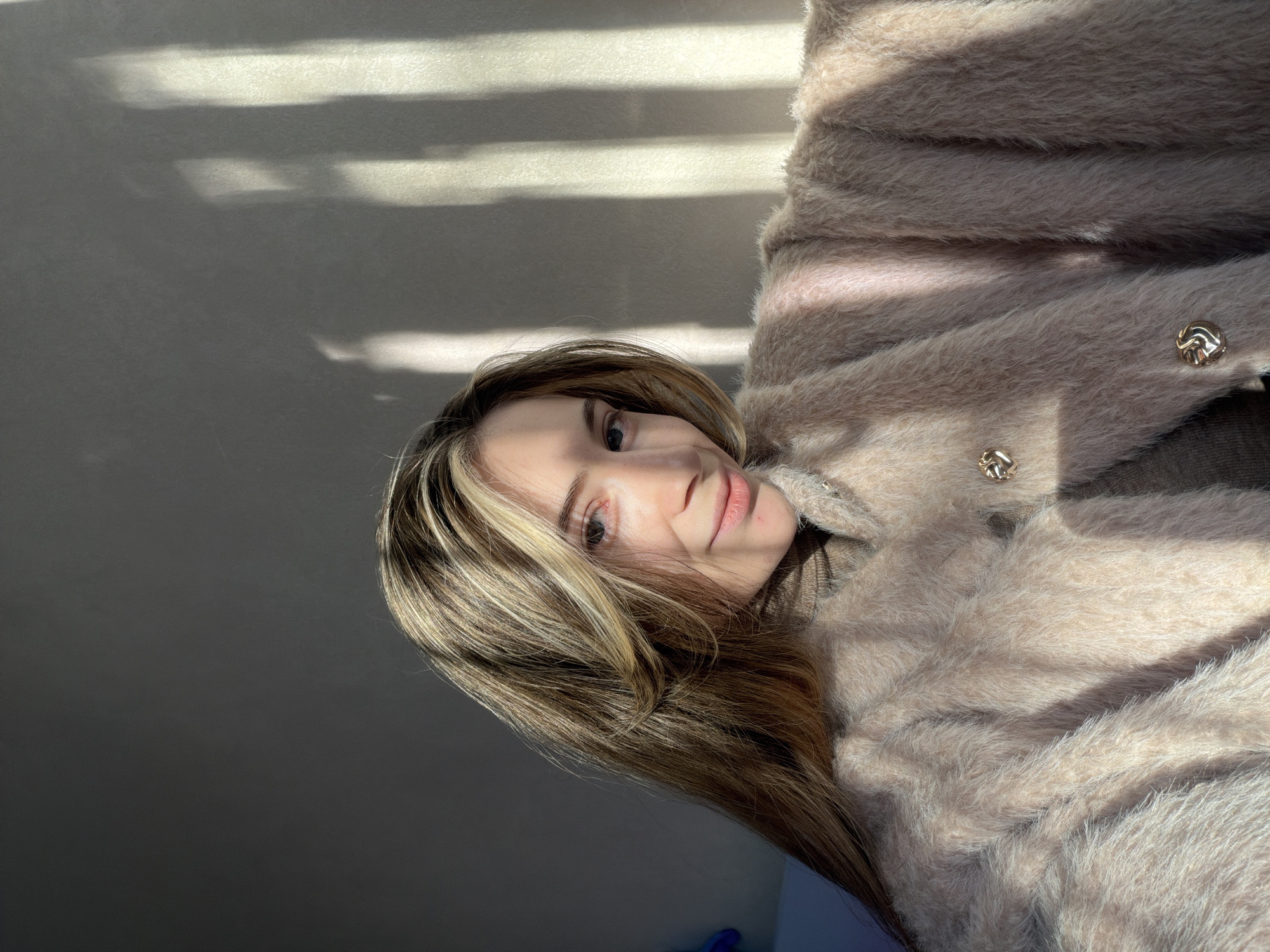 Woman photographs herself indoors in Plovdiv, Bulgaria