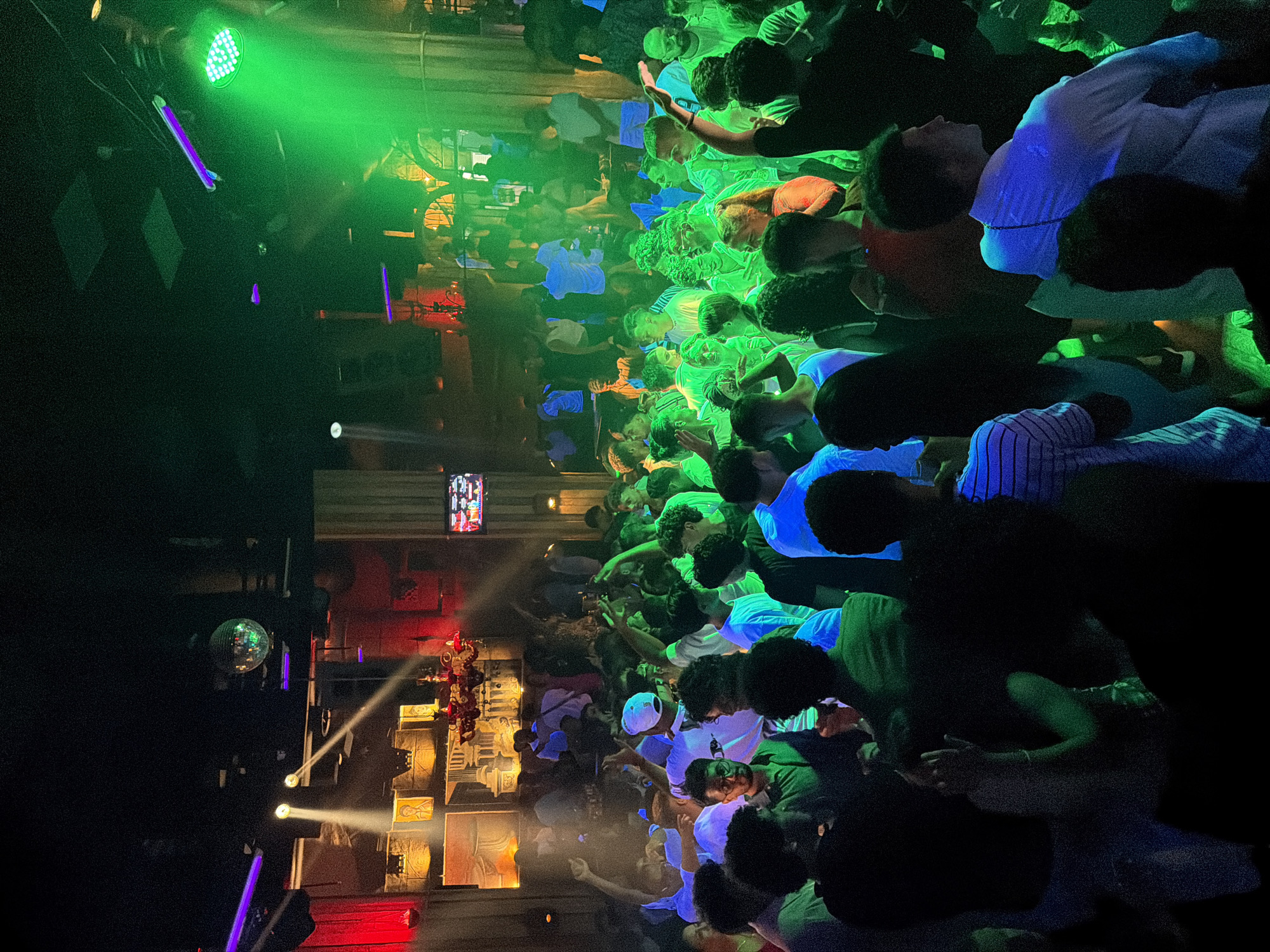 Crowded nightclub night in Sharm El Sheikh under disco lights