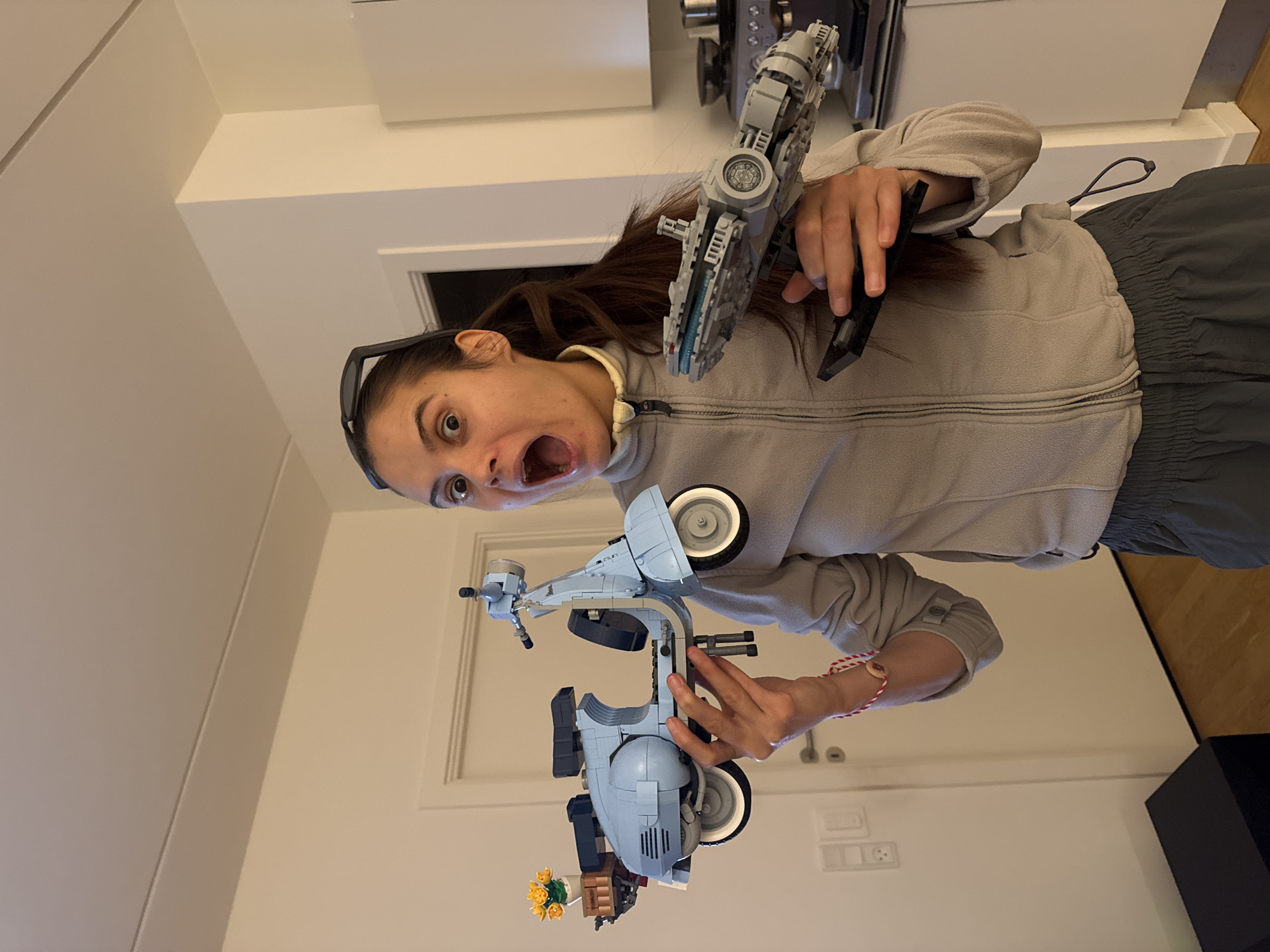 Woman celebrates with Lego Millennium Falcon in Copenhagen