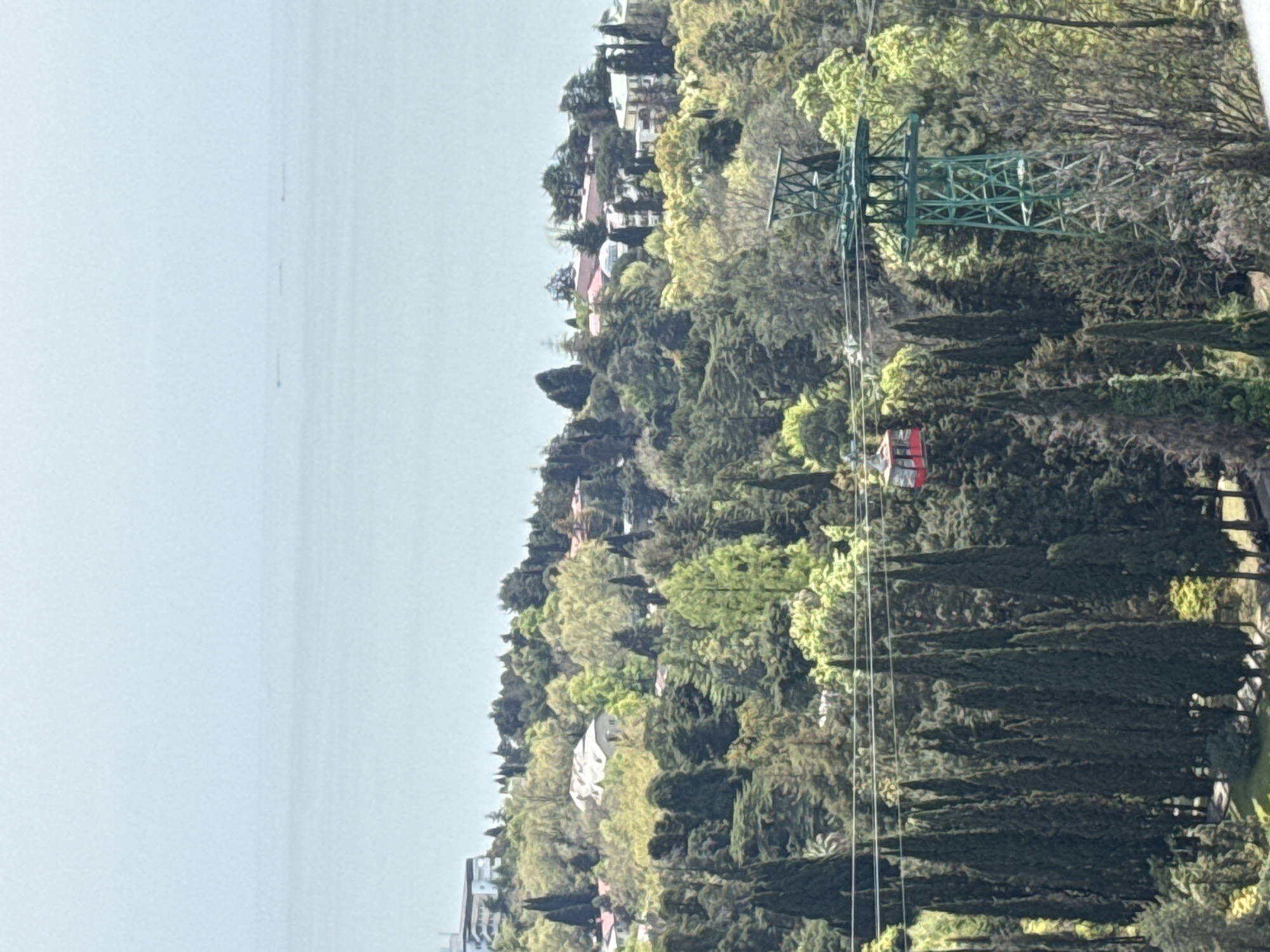 Elevated panoramic view of Sochi's forested hills, Black Sea