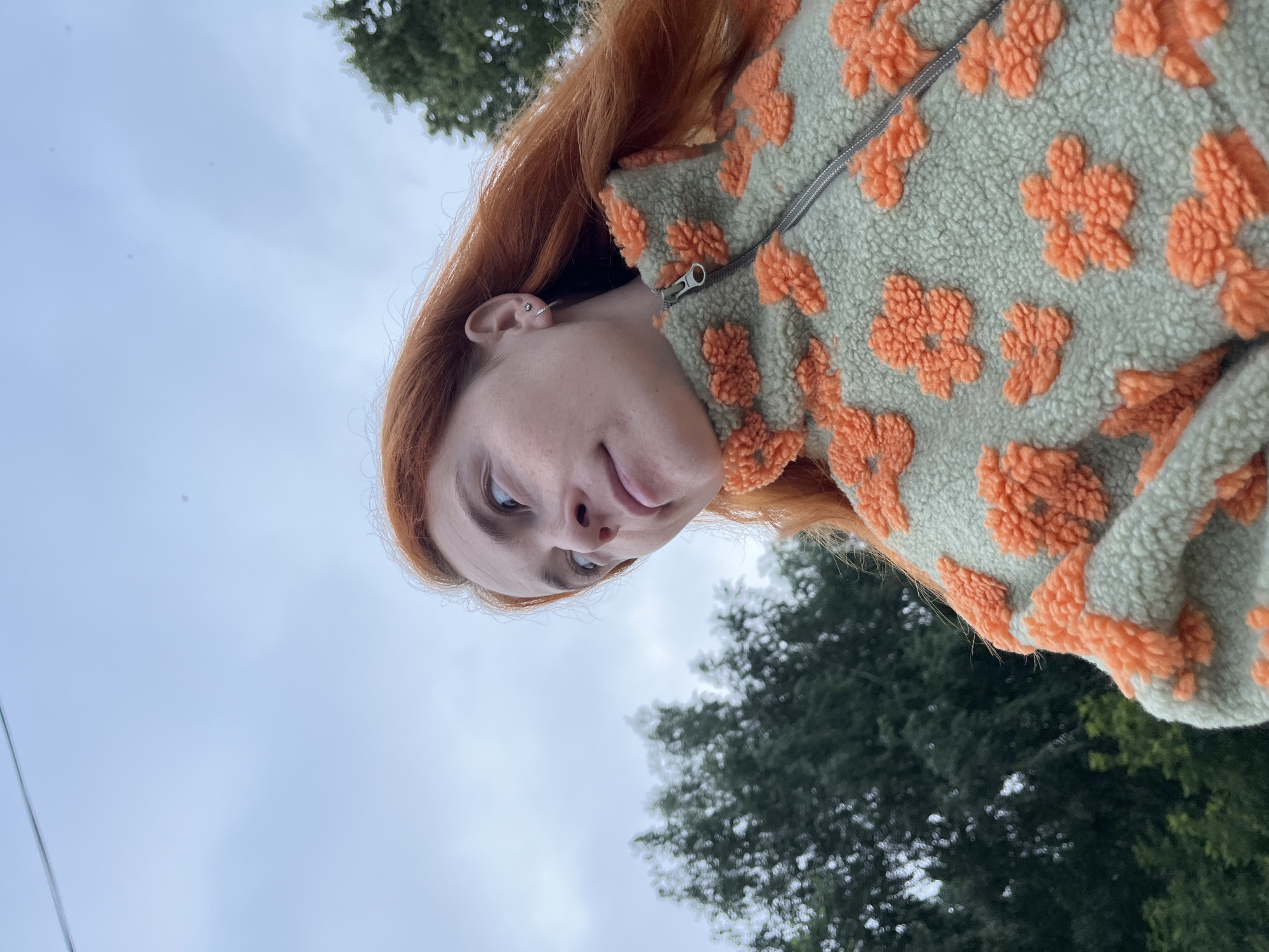 Selfie session outside a Chaikovsky apartment block, July 2026