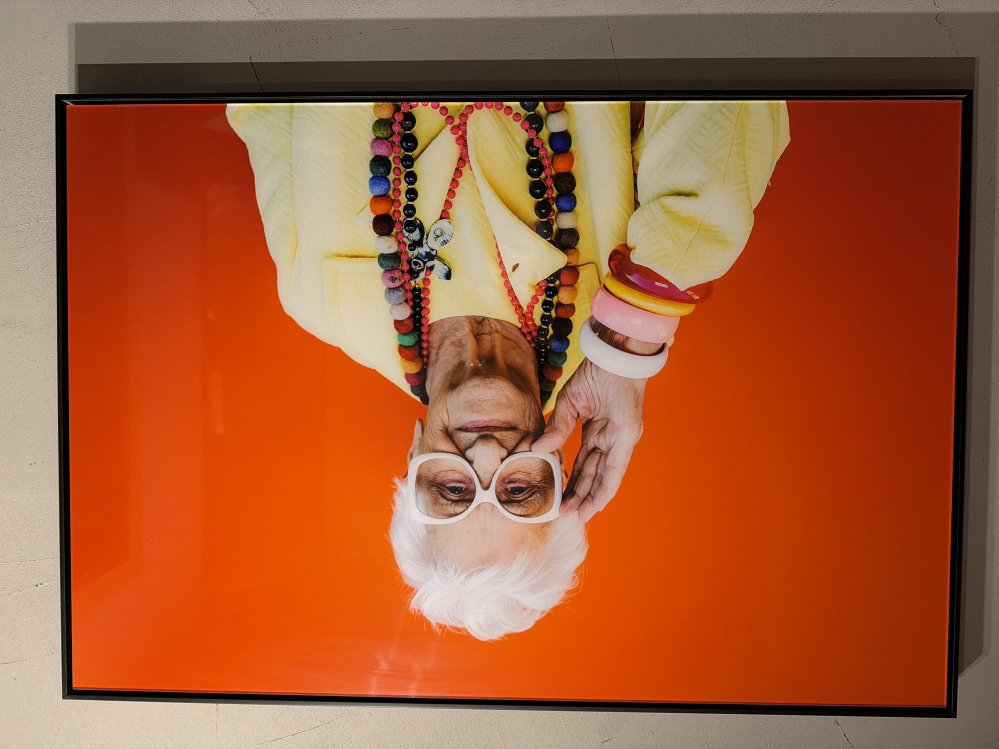 Framed portrait of elderly woman displayed on Sofia wall
