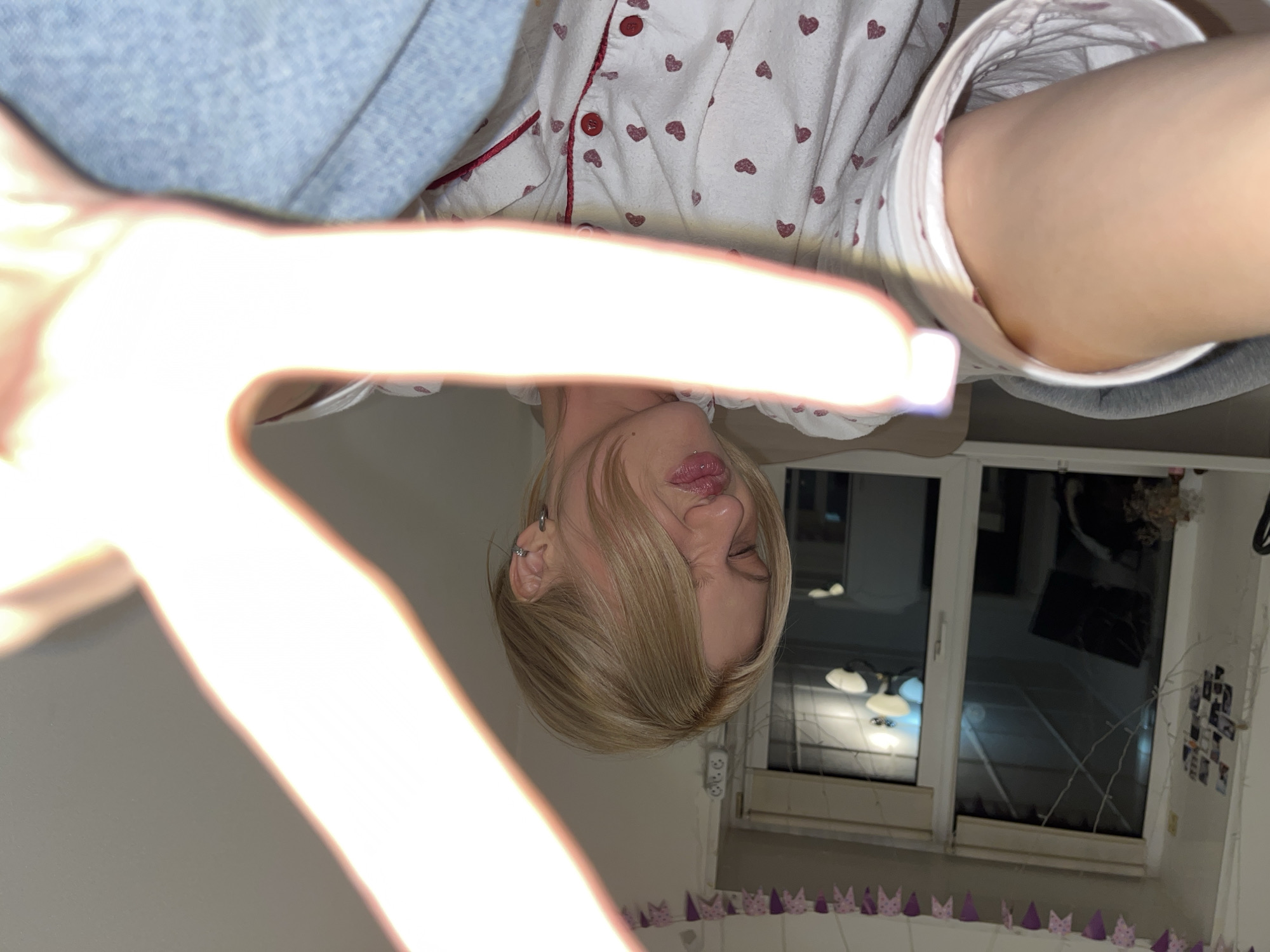 Woman Takes Multiple Selfies in Bedroom in Chaikovsky