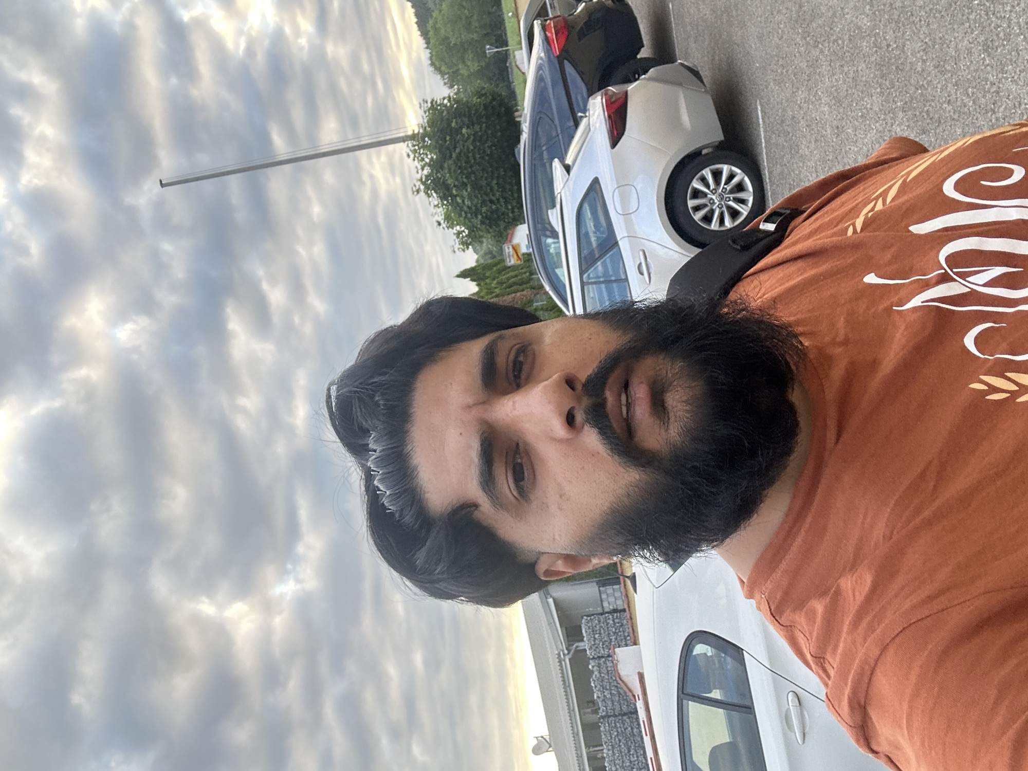 Outdoor selfie in a Mainburg parking lot, July 2026