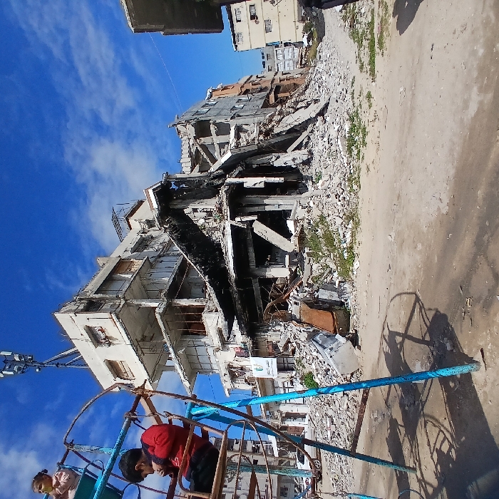 Children play amid urban destruction in Gaza City