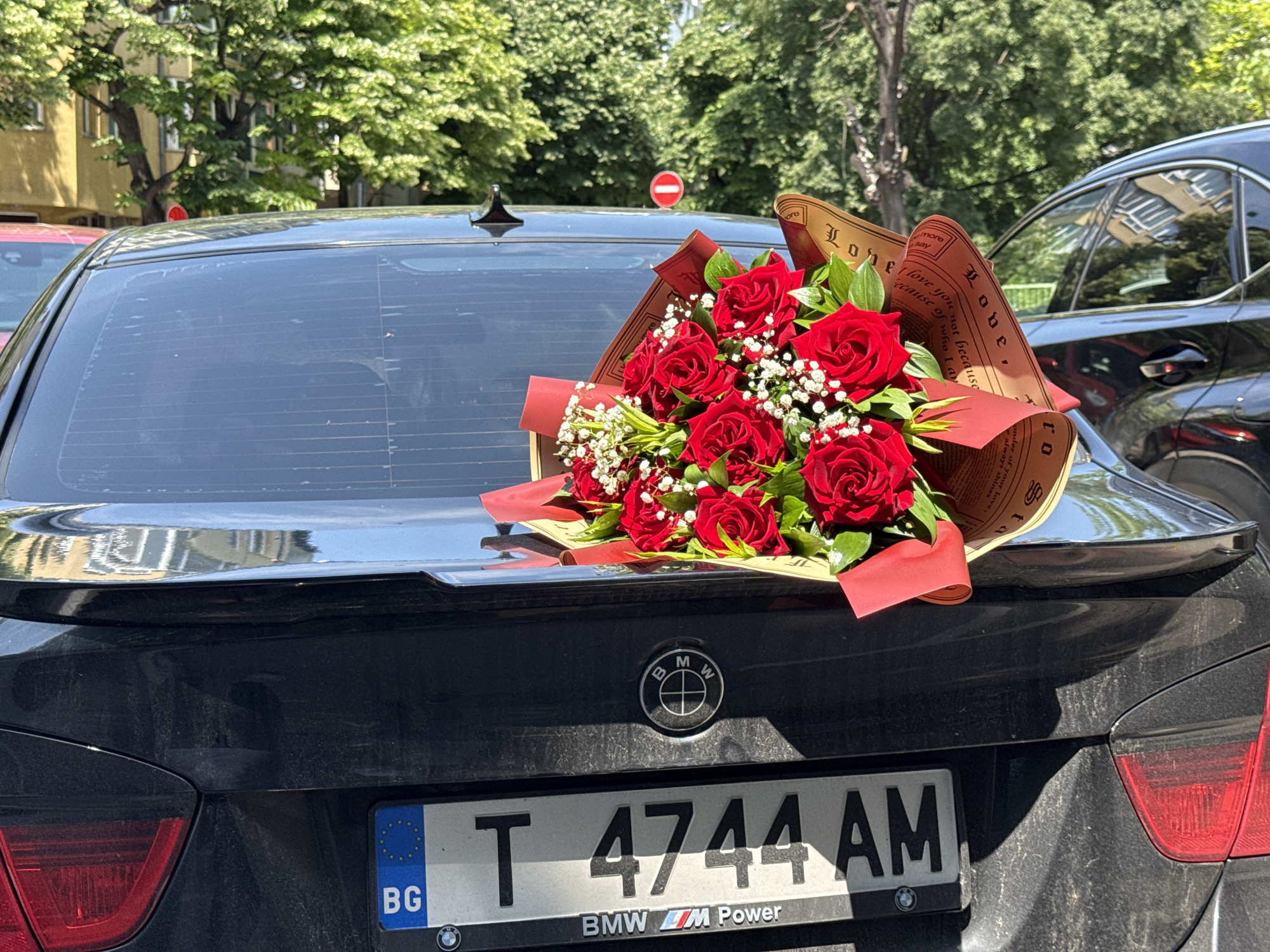 Rose bouquet placed on BMW trunk in Varna