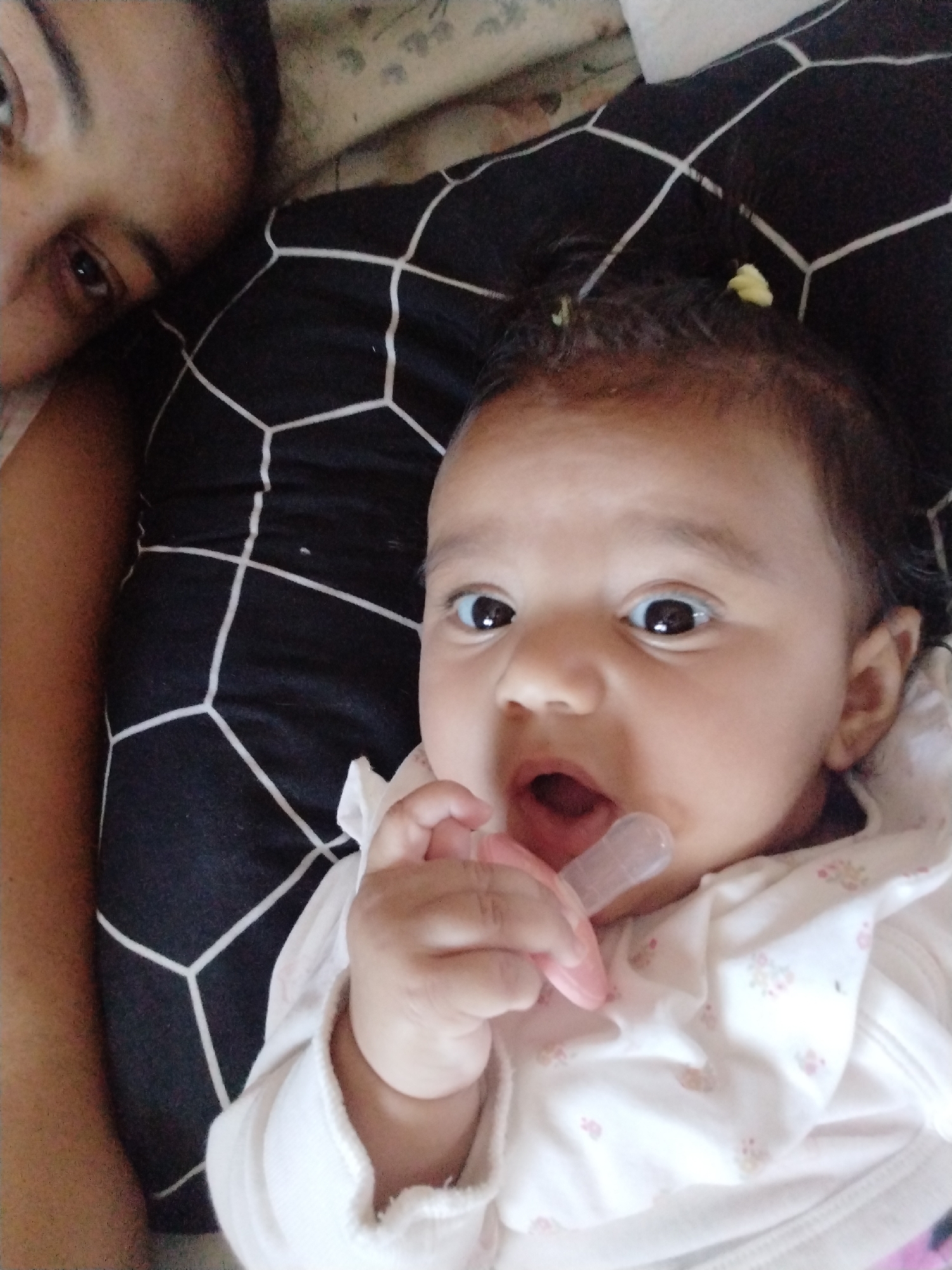 Mother and infant spend quiet morning time in bedroom