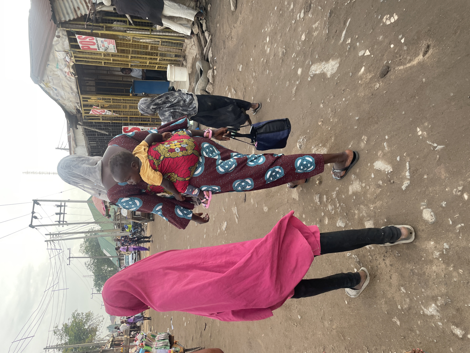 Morning market life documented on Abuja dirt road
